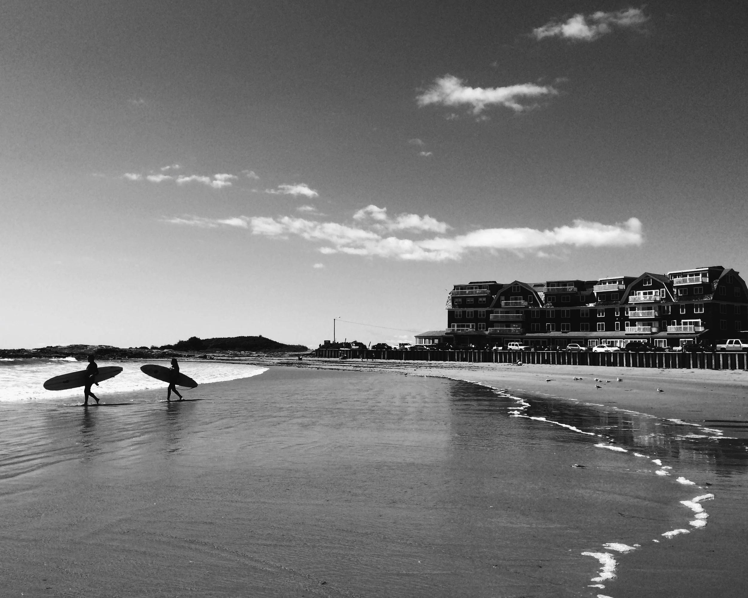  Surfers make their way into the waves in Kennebunkport, Maine over Labor Day weekend. 