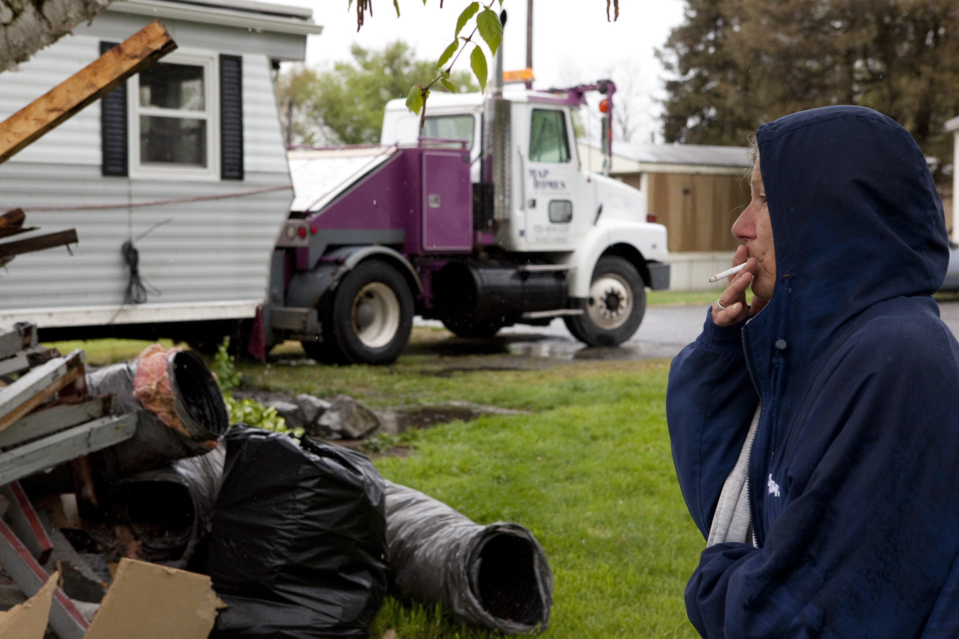 Diane Smith, 58, smokes a cigarette while waiting anxiously for her trailer to be moved from Riverdale Mobile Park to Loyalsock Pennsylvania, a small township 30 miles northwest from Jersey Shore. She endured many sleepless nights because she is wor