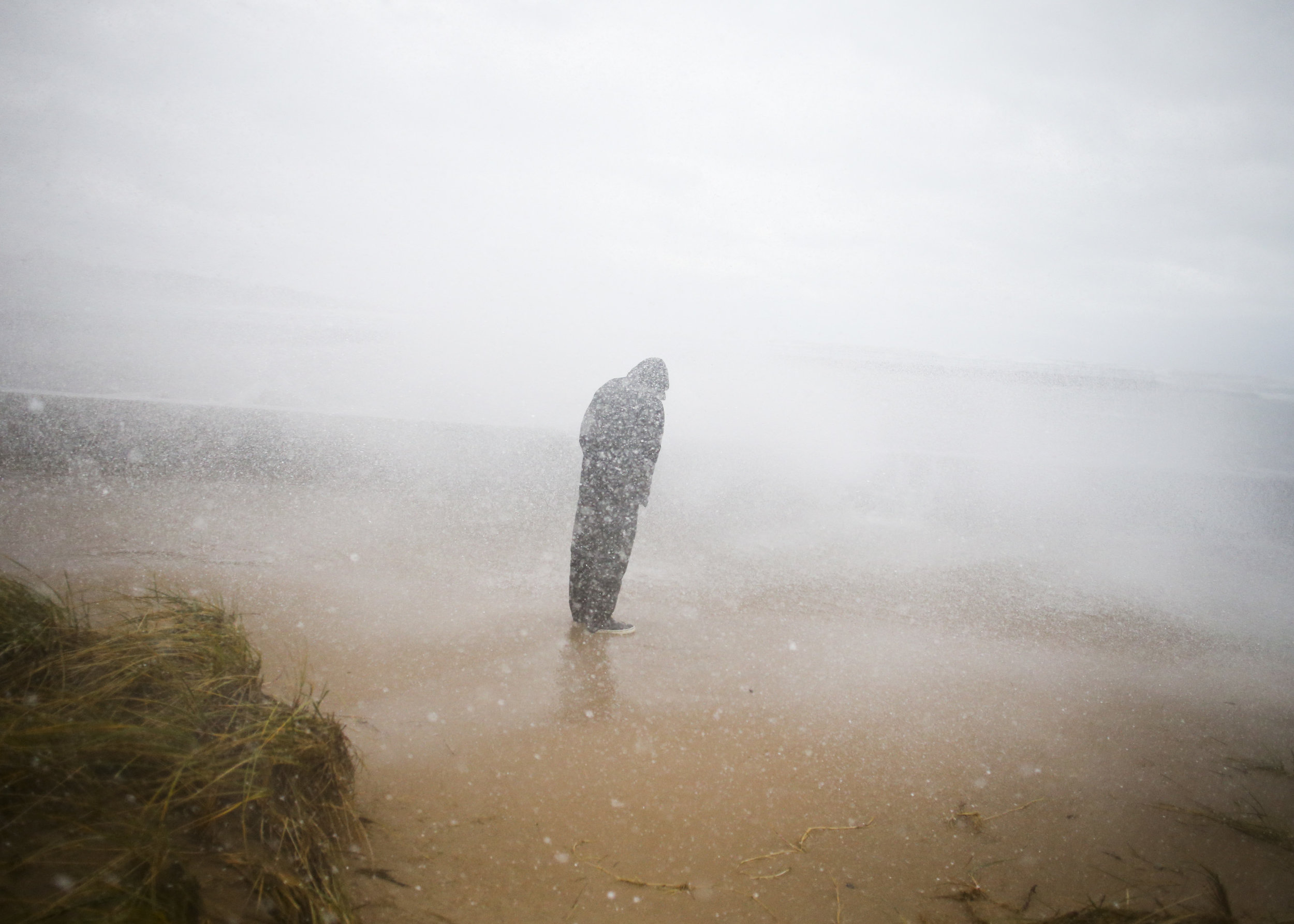 Steve Baker braves the waves during a storm along Lake Michigan in Saint Joseph.