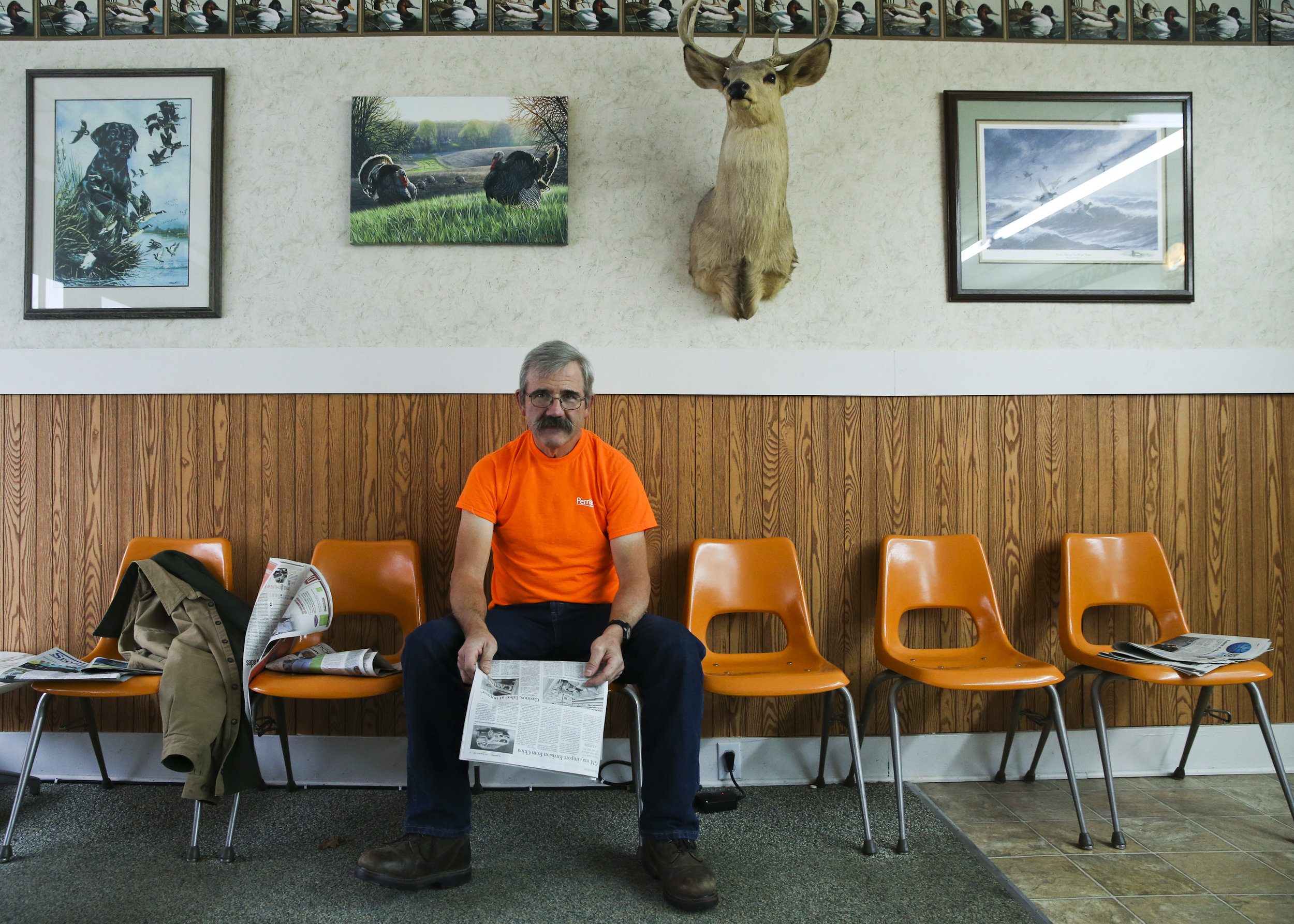 Gary Anderson expresses his relief that Perrigo, a multinational corporation that started in Allegan County, and is the county's biggest employer, decides to stay headquartered in Michigan at Hairs End barbershop in Allegan, MI on Friday November 13, 2015. Anderson's wife works at Perrigo.