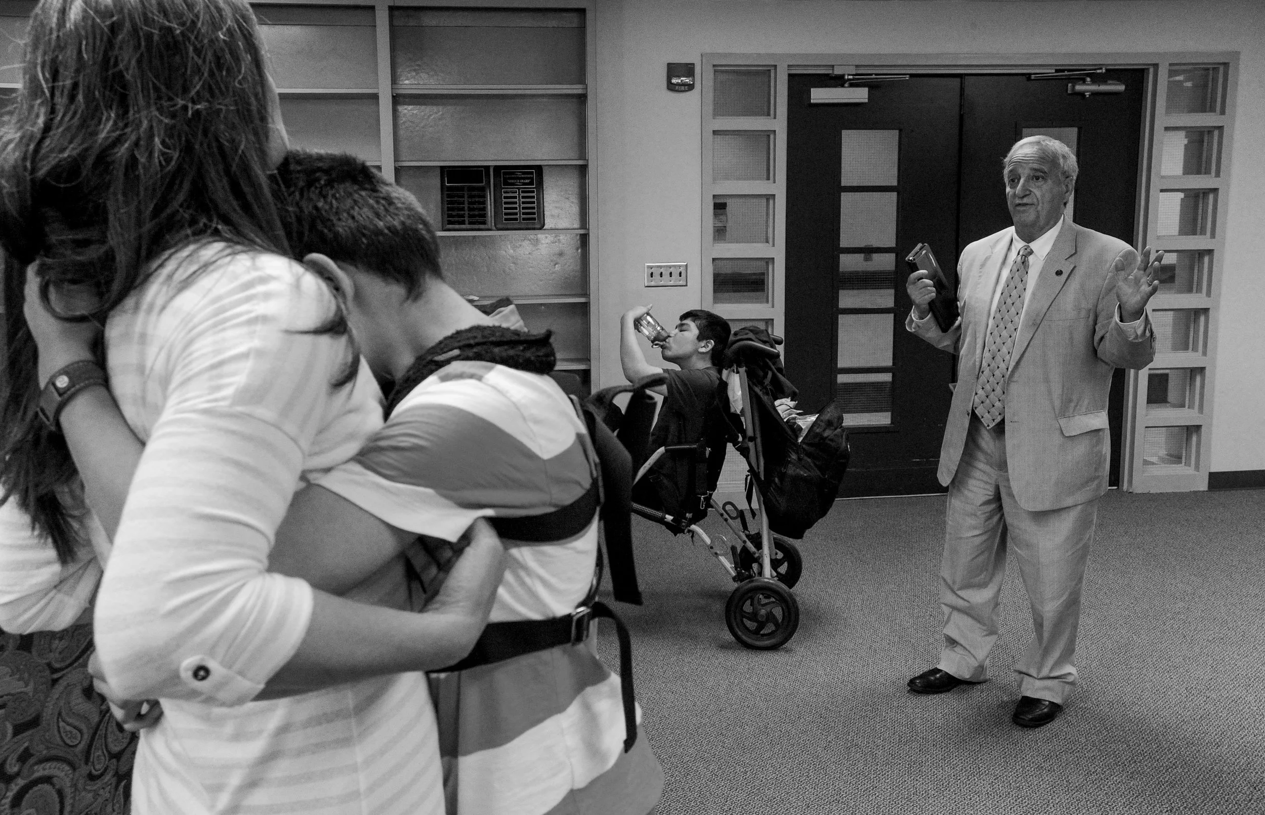  Rep. Mike Ball, R-Huntsville, (right) talks with Jody Perkins (left) and other families about the first vote on a modified version of Leni's Law at the Alabama State House on April 14, 2016. The original bill allowed anyone with a debilitating medic