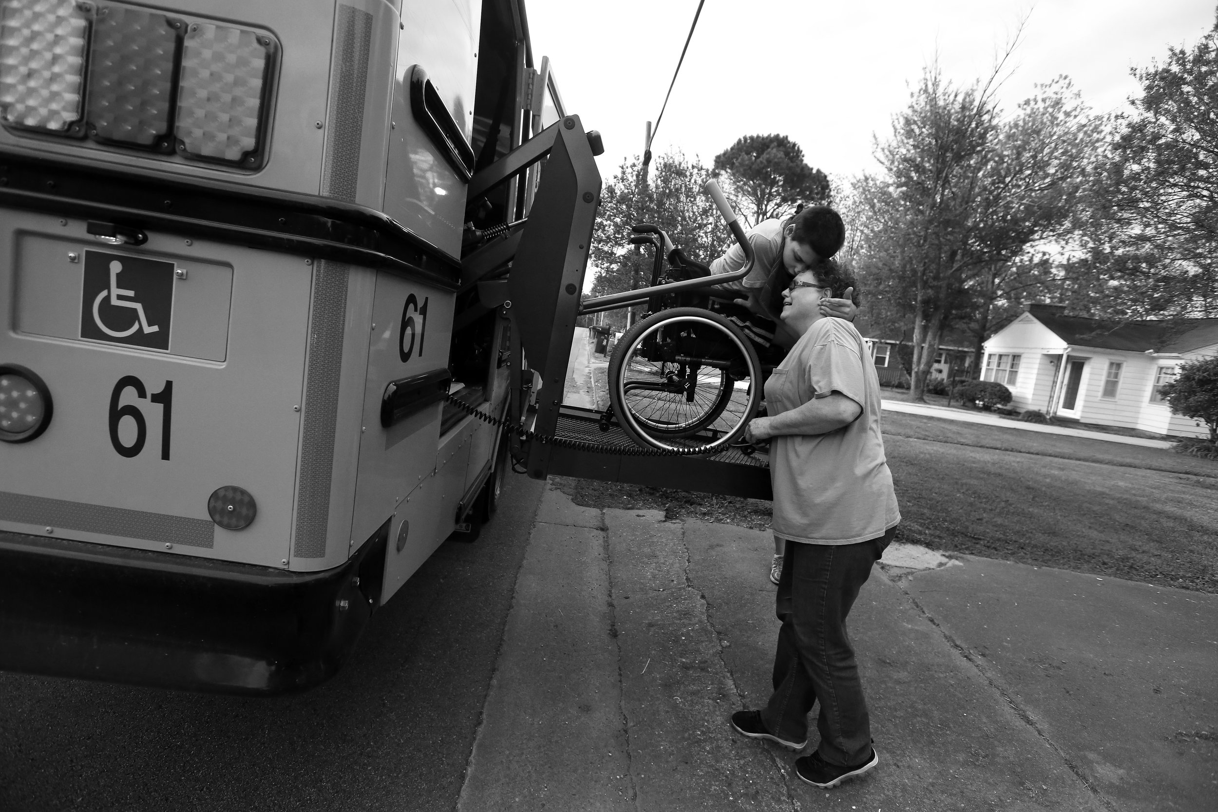 Belinda Johnson helps Robert onto the school bus, April 19, 2016. Robert is an eighth-grader at Oak Park Middle School. He’s attended school since the age of 3.&nbsp; 