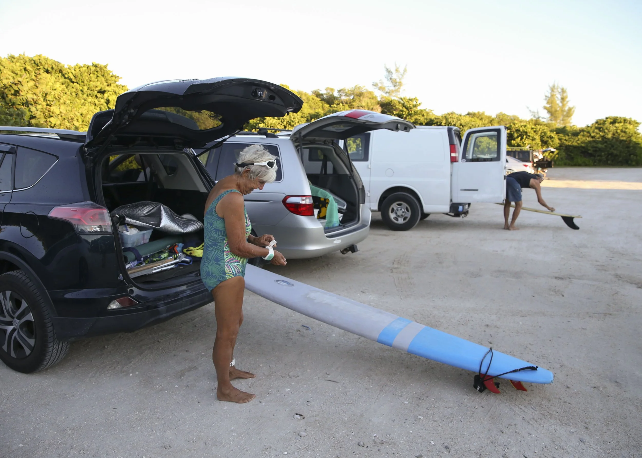  Campbell, 81, prepares to go out for a morning in the water with her surfing friends, Wednesday, Sept. 7, 2022, at Walton Rocks Beach in St. Lucie County. 