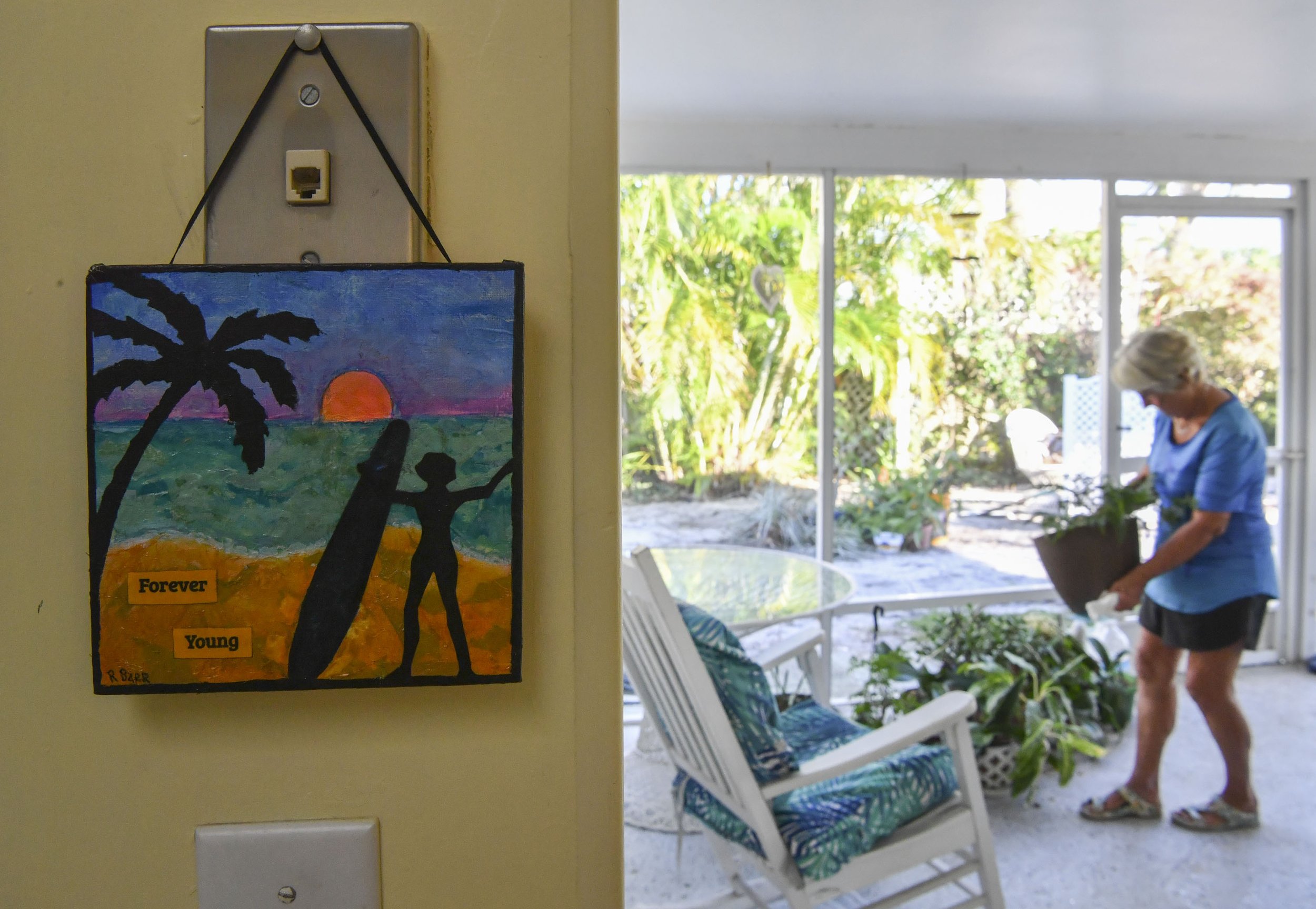  Artwork with the phrase "forever young" hangs in Nicki’s home, Wednesday, Nov. 23, 2022, in Stuart. “Stay as active as you can be and do whatever makes your spirit sing. When your spirit sings you feel ageless. I truly feel ageless when I'm at the b