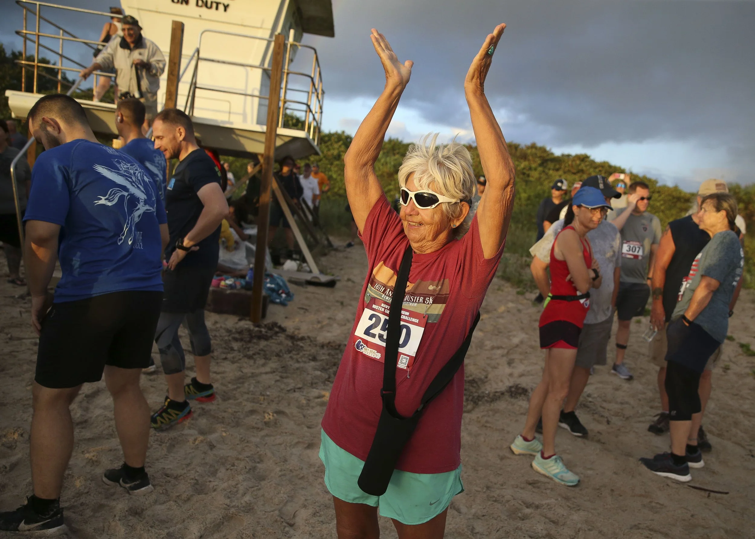  Campbell does "gratitude stretching" before participating in the Muster 5K Beach Challenge during the 37th Annual Muster and Music Festival on Saturday, Nov. 5, 2022, at the National Navy UDT-SEAL Museum in Fort Pierce.  