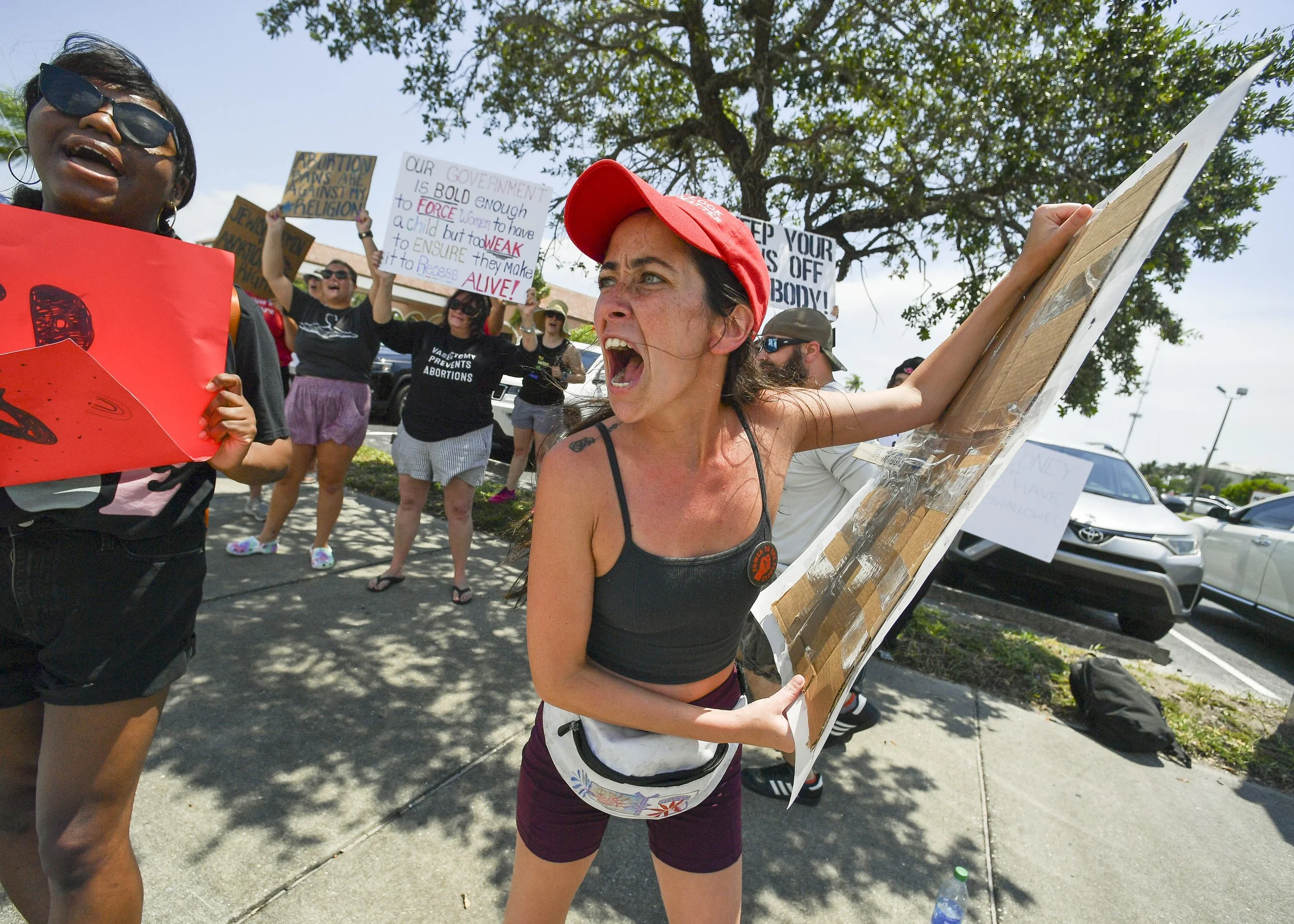 "We're supposed to be Americans, and this isn't very American of us to strip us of our freedoms and treat us like second class citizens," said Amanda Conticello, of Jensen Beach, who joins about a couple hundred people in the "We Dissent" protest on