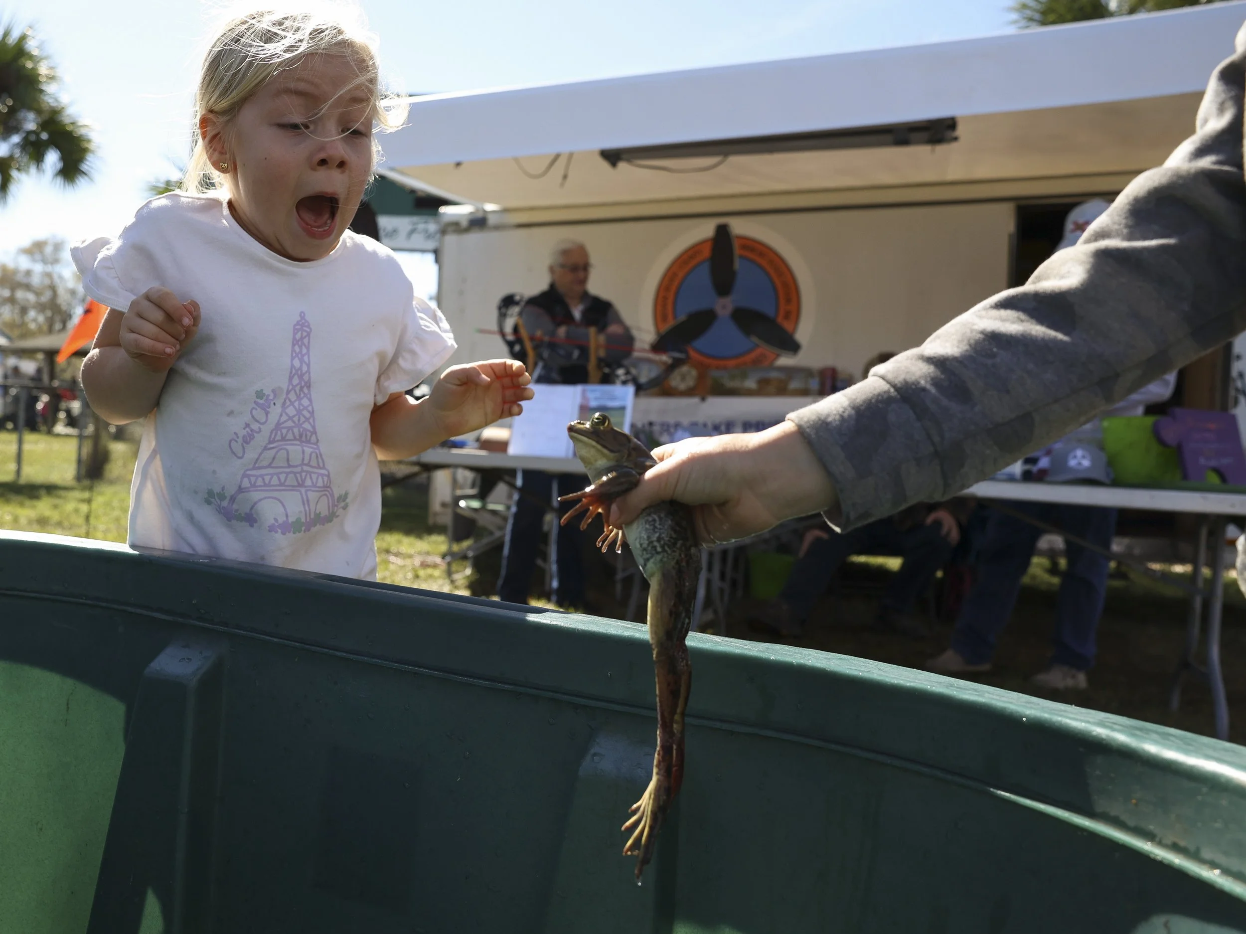 Evelyn Krupinski, 7, of Melbourne, screams at the sight of a frog during day three of the 33rd annual Fellsmere Frog Leg Festival on Saturday, Jan. 20, 2024. 