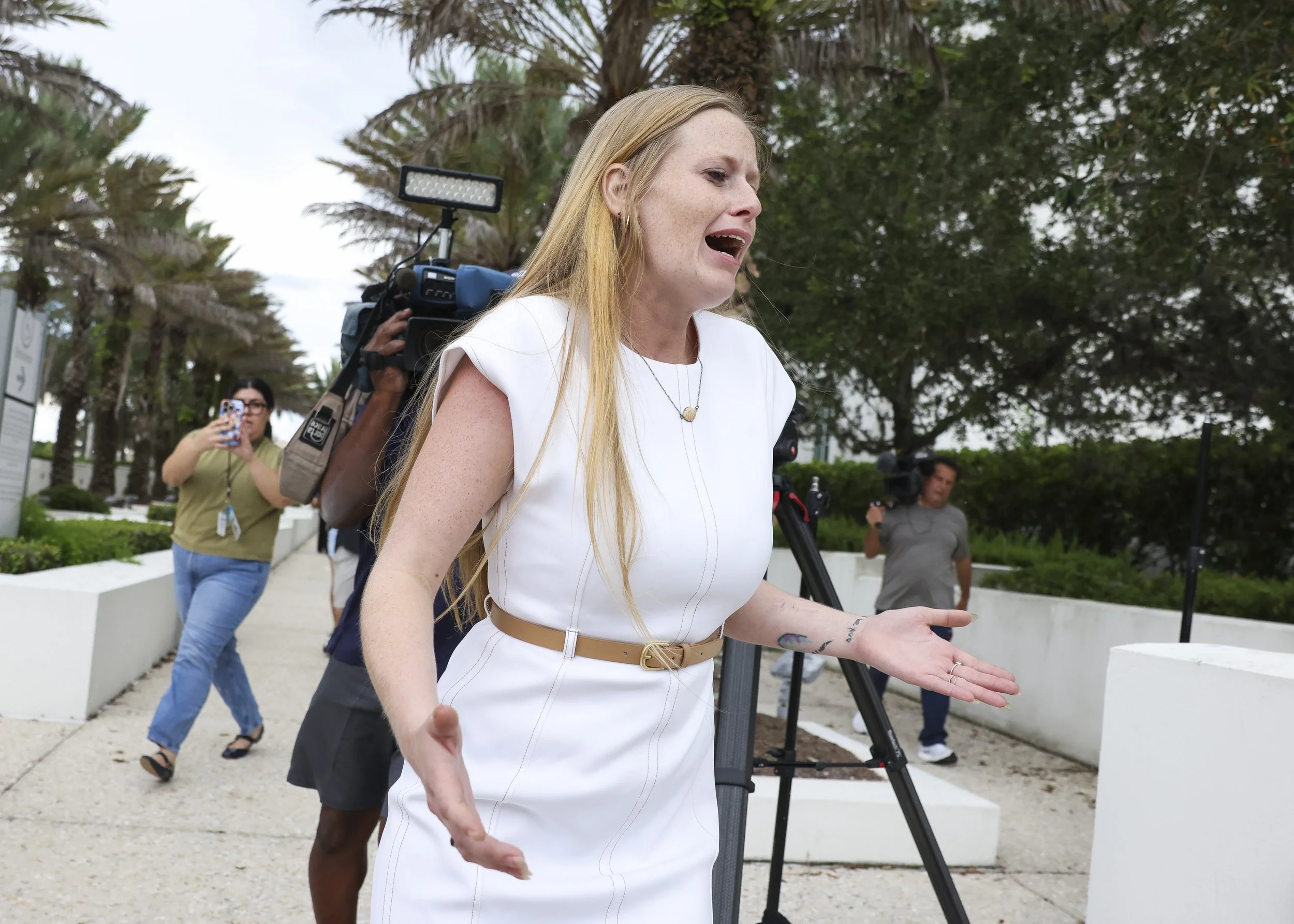  Ryan Wesley Routh's daughter Sara Routh runs from the Alto Lee Adams, Sr. U.S. Courthouse in Fort Pierce after a jury on Sept. 23, 2025, found her father guilty of plotting to assassinate Donald Trump when he was a presidential candidate, at his gol