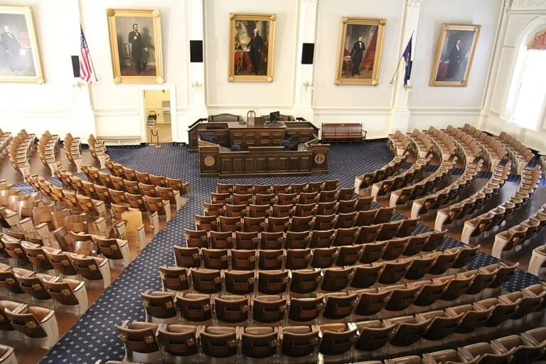  The House Chamber of the New Hampshire State House in Concord, NH  Photo by Royalbroil via Wikimedia Commons  
