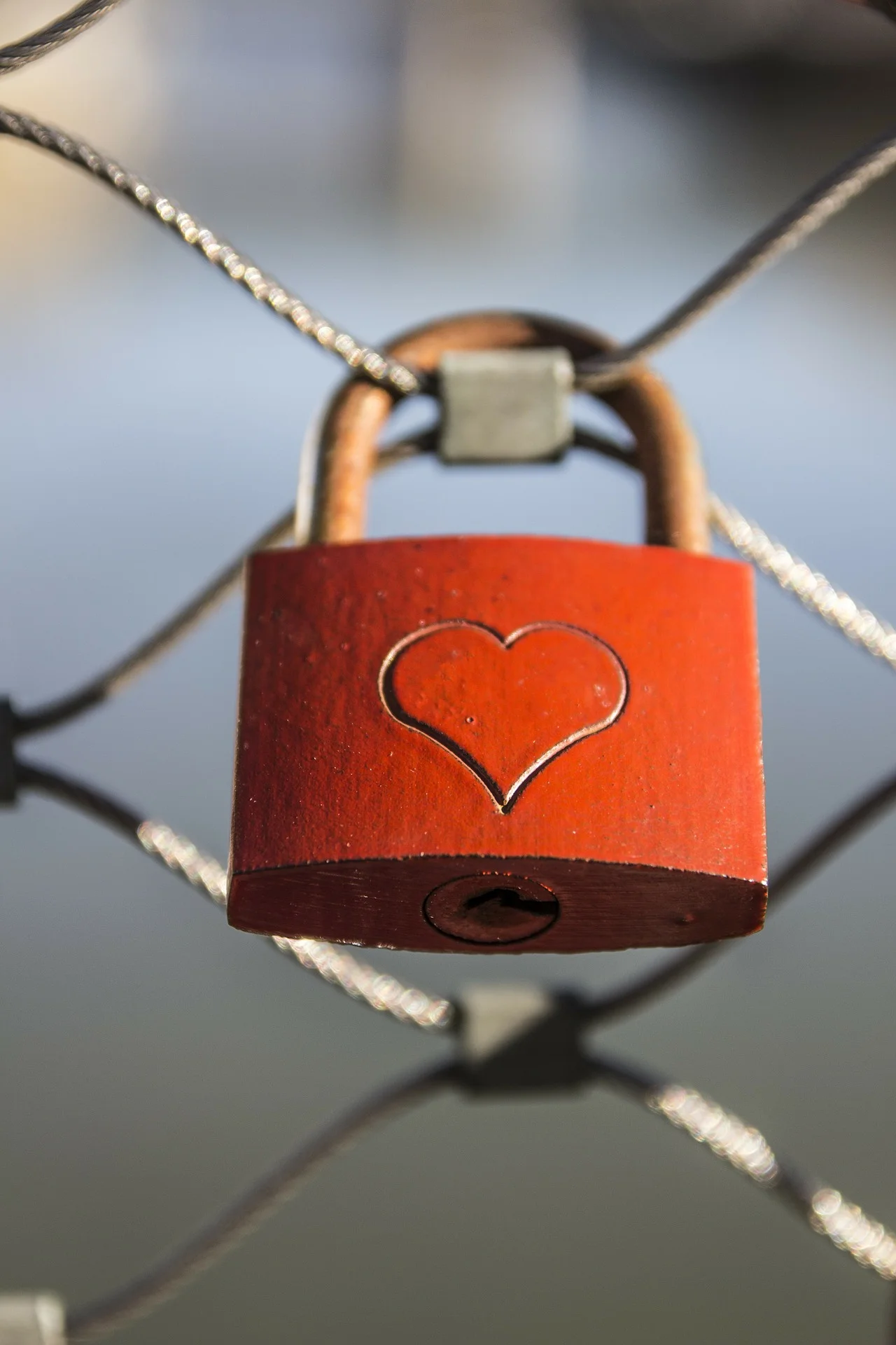 red padlock with a heart etched on it