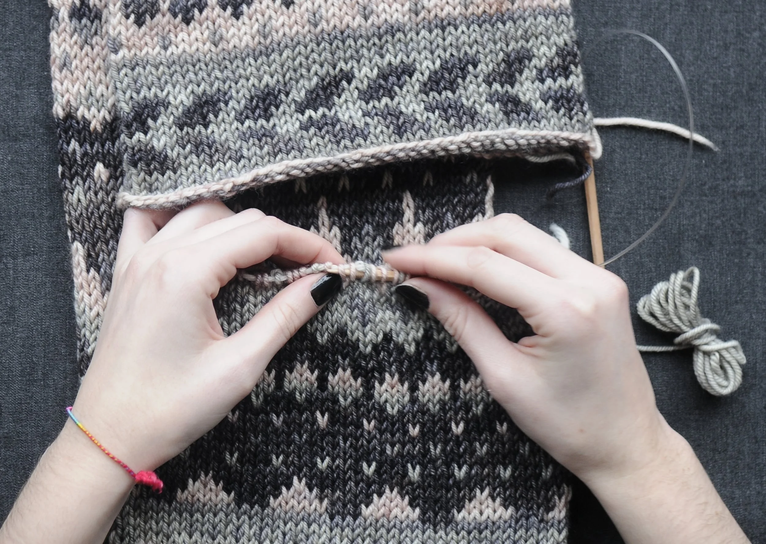 1: Start by placing your live stitches back onto a circular needle and remove waste yarn.