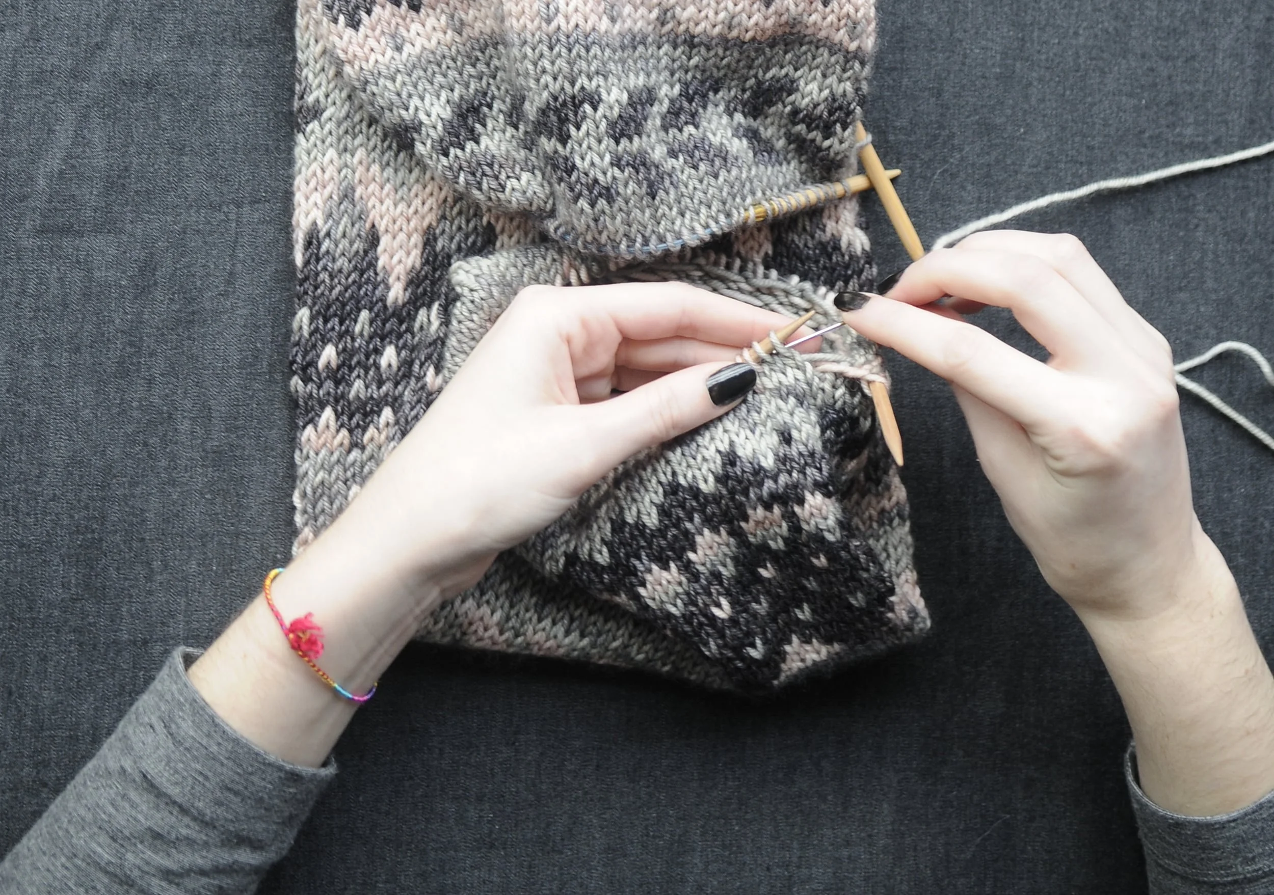 4: Thread darning needle and slide it into the first stitch, as if to purl, on BN. Leave stitch on needle and pull thread through. You'll want to pull your thread snug but not too tight. 
