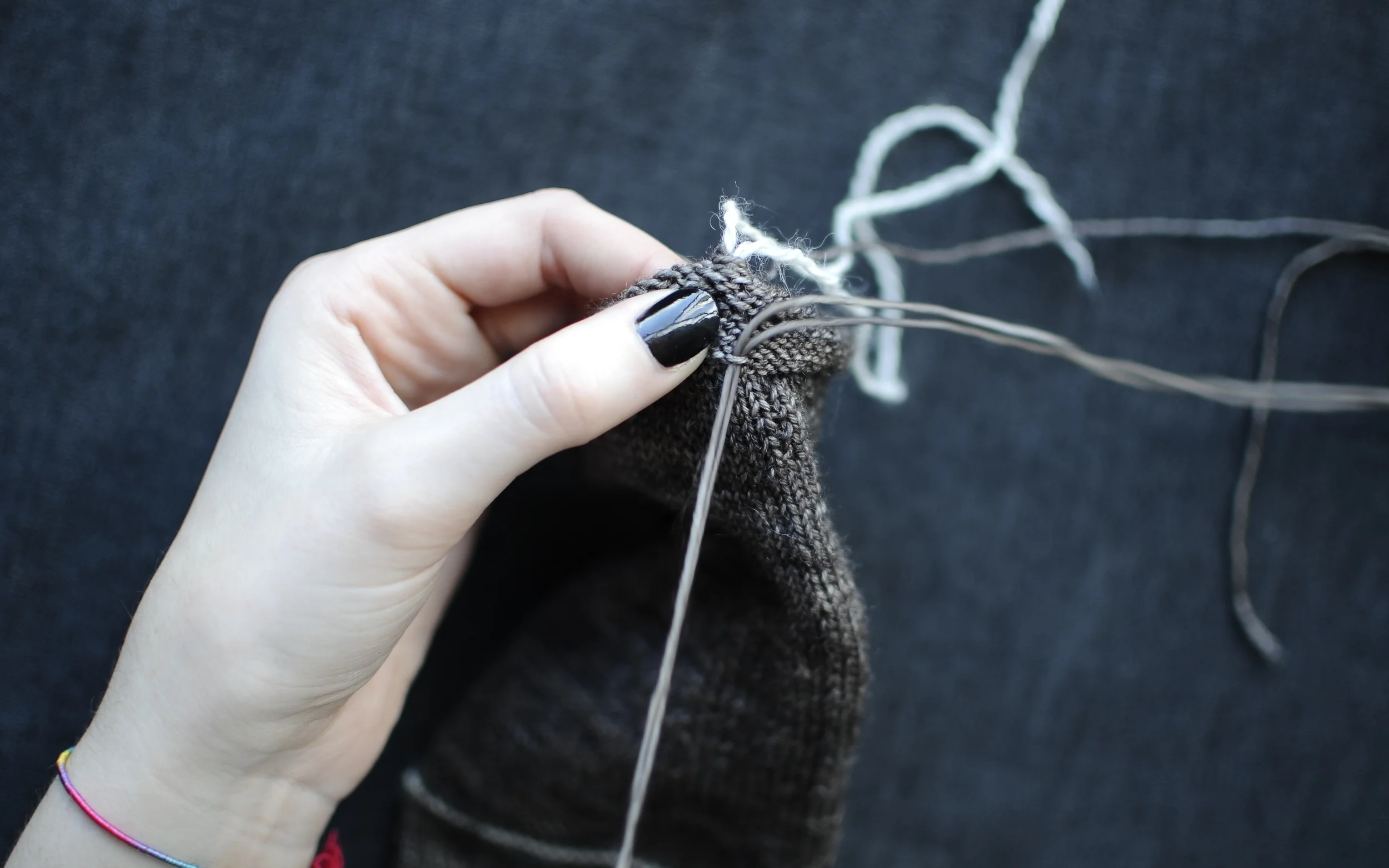 6. Pull the yarn through to close up the hem.
