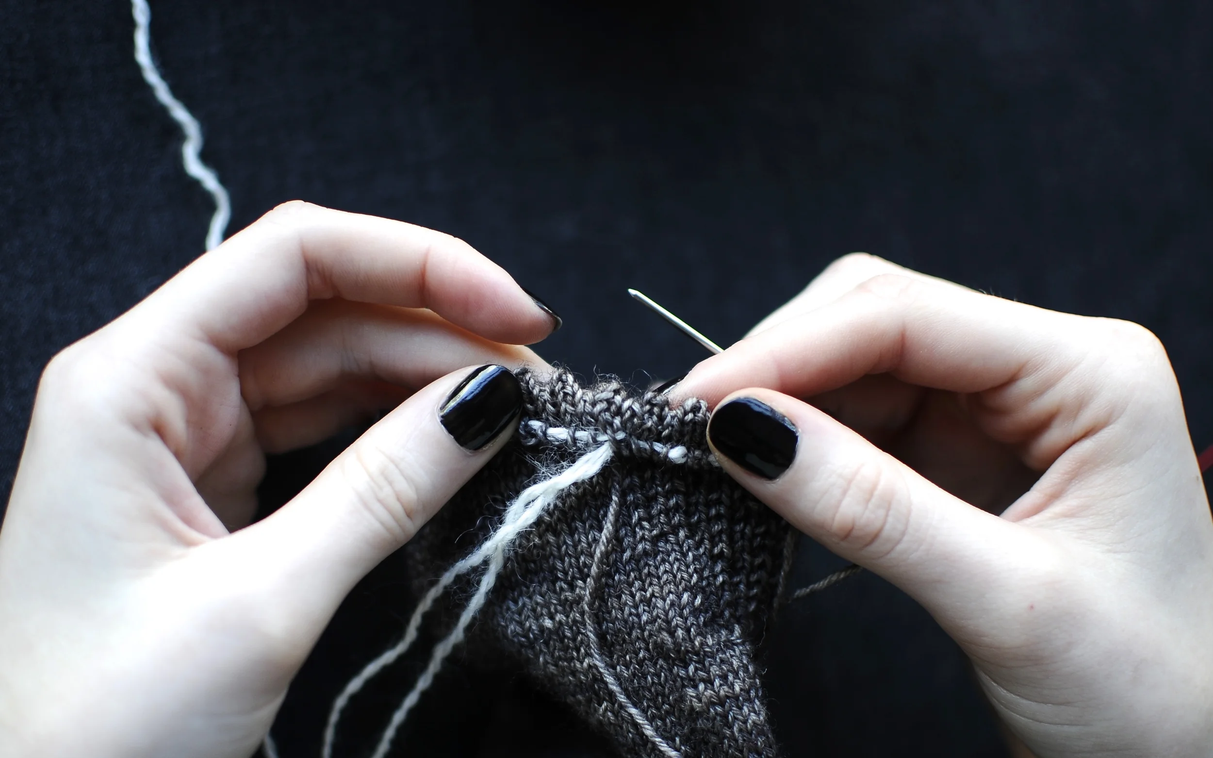 11. Once the hem is sewn down completely, weave in Yarn A and trim excess yarn. 