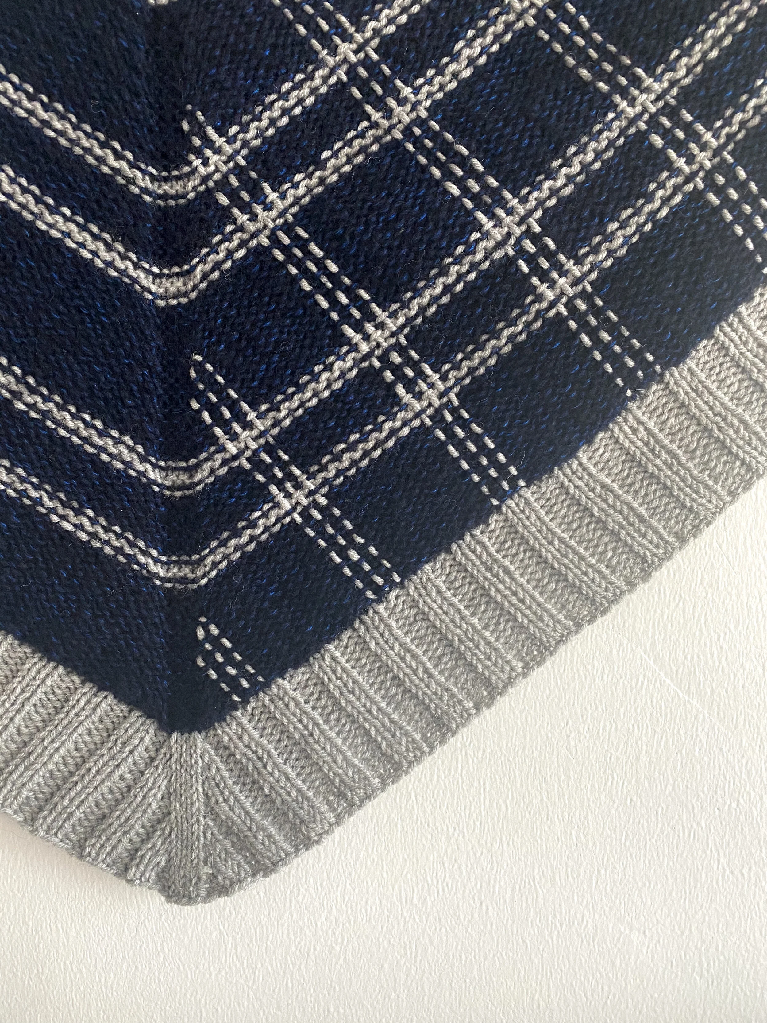 Close up of embroidery on right side of Synthesis Shawl.