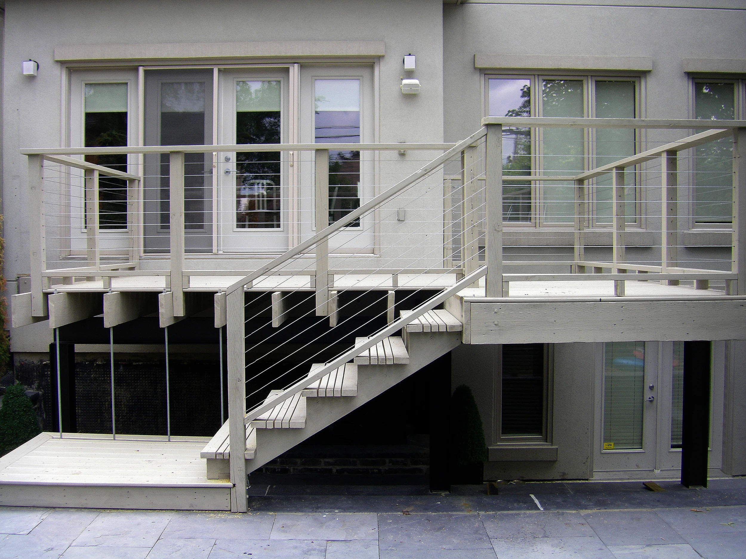 Modern Cantilevered Wood Deck with Cable Railing