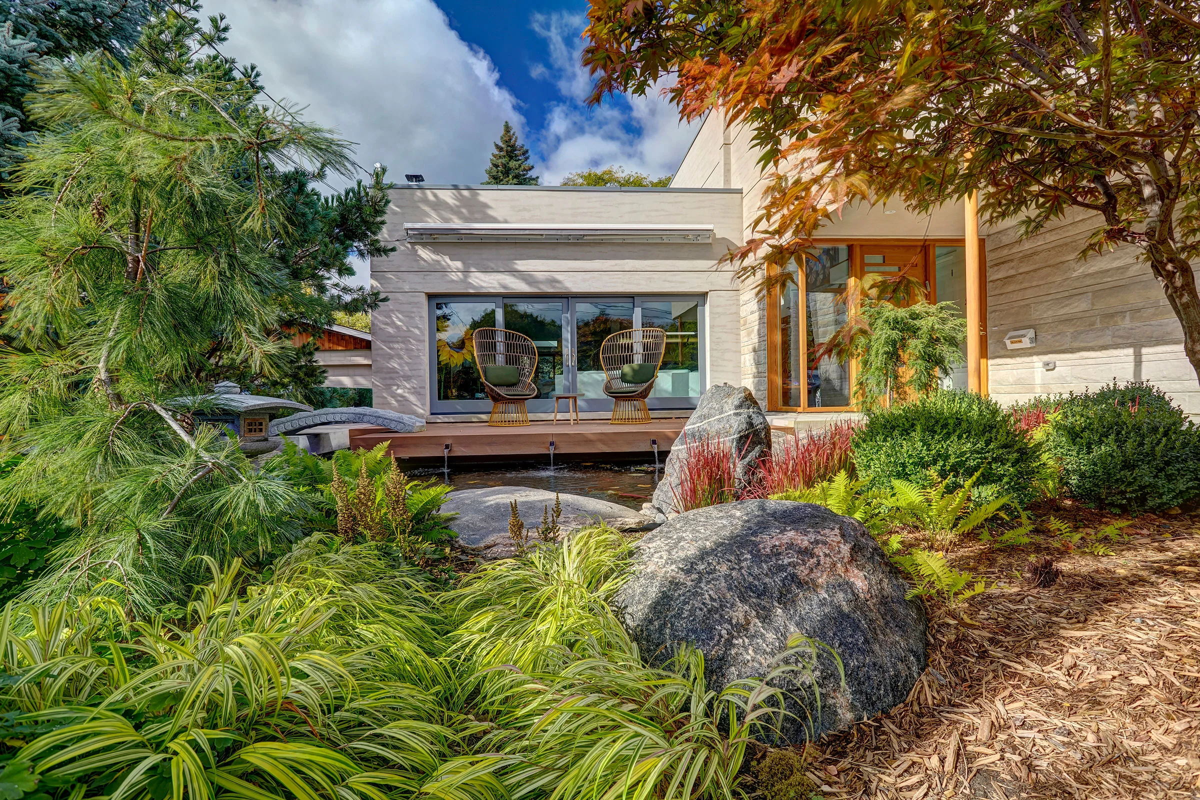 The arrangement of these landscape elements and plantings demonstrate the Japenese Zen garden design technique of framing views.