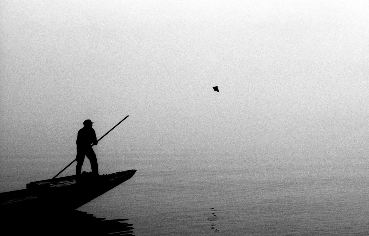 3.  Man in Boat with Bird 1976 web.jpg