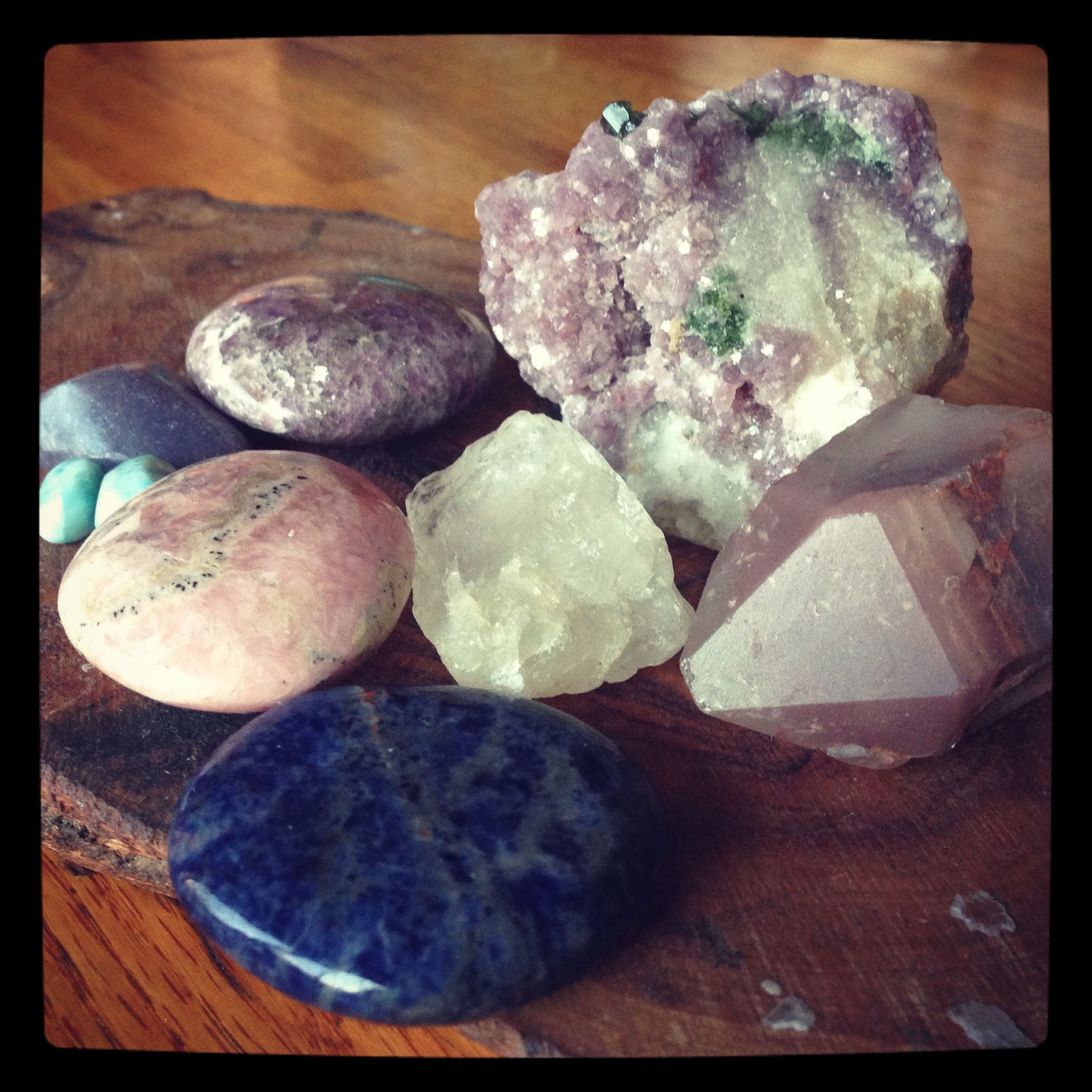 Stones for anxiety, high blood pressure and pre-eclampsia from Upper Right, Lepidolite, Lithium Quartz, Sodalite, Petalite in the middle, Rhodochrosite, Larimar, and two more pieces of Lepidolite. 
