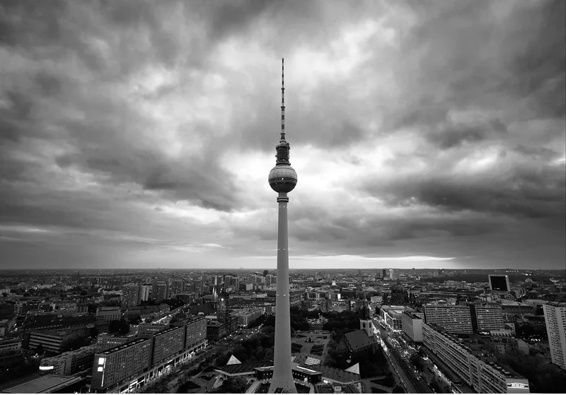 FERNSEHTURM The television tower, or Fernsehturm, stands 1,198 feet above Alexanderplatz in Berlin. Construction was completed in 1969 by the East German government that frequently sought opportunities to display its power. As a result, the tower stands more than twice the height of the Funkturm radio tower in West Berlin. The Communist leader in East Berlin, Walter Ulbricht, chose to construct the Fernsehturm near the Palace of the Republic to create an axis of East German power in Alexanderplatz. Due to the geometric shape of the metal ball that sits atop the tower, when the sun shines just right, a glowing cross appears. This phenomenon became known as the “Pope’s Revenge” as a comment to the atheistic nature of the Communist rulers and their propensity to destroy churches.
