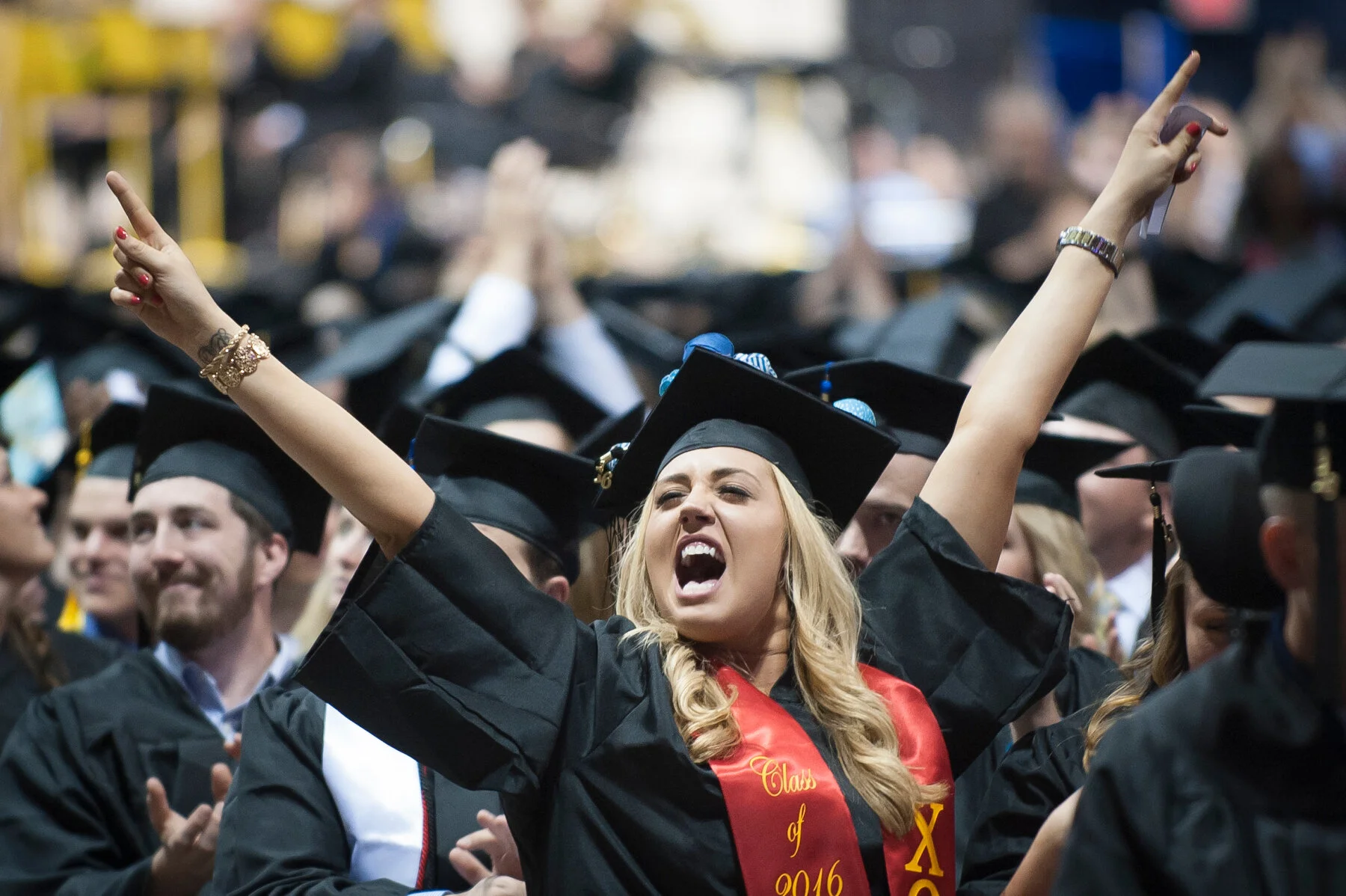  A student celebrates during Montana State University commencement exercises. 