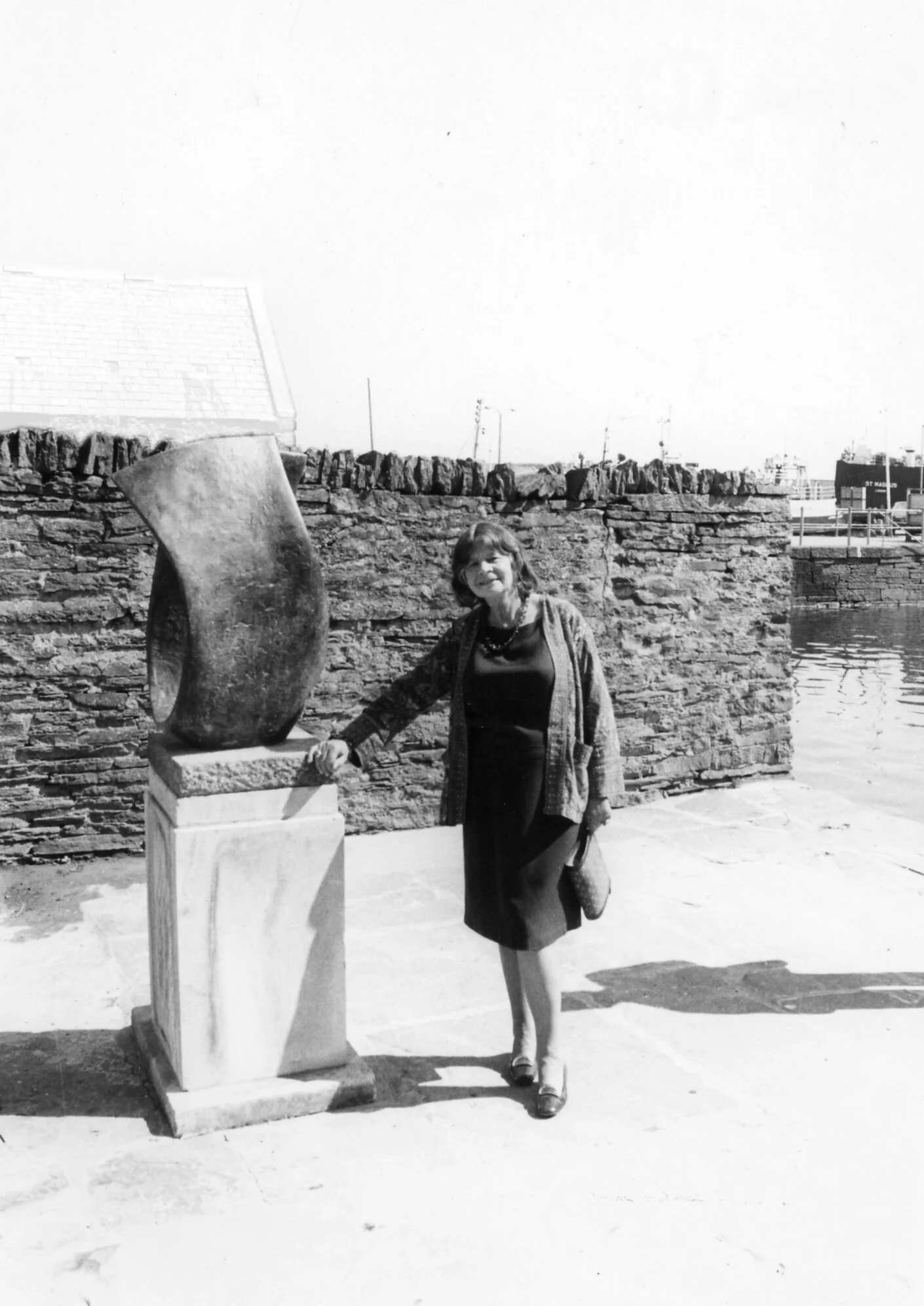 Image: Margaret Gardiner c. 1980 at the Pier Arts Centre with Barbara Hepworth’s sculpture Curved Form (Trevalgan) 1956