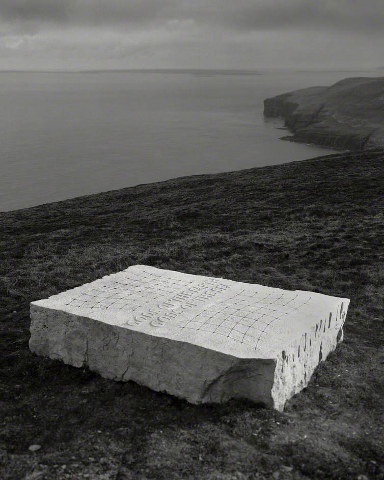 This week our #WednesdayWorkoftheWeek is Gods of the Earth/Gods of the Sea &ndash; by Ian Hamilton Finlay (with Nicholas Sloan), Sited on Rousay in 2005
Photograph, Robin Gillanders (b.1952) 

The Scottish poet, artist and gardener Ian Hamilton Finla