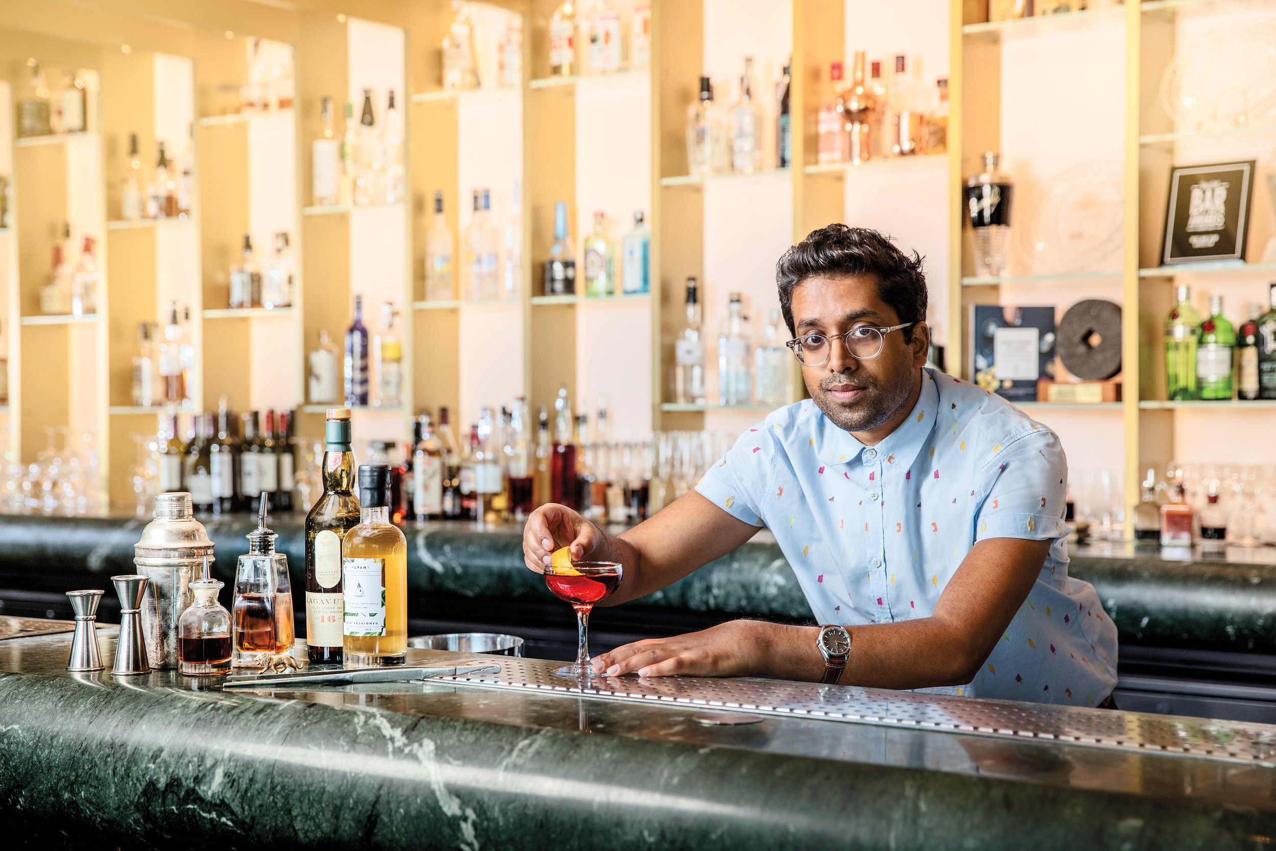  Award winning bartender and mixologist Ryan Chetiyawardana at Dandelyan Bar (now named Lyaness). London UK.  Whisky Advocate  Winter 2016. Photography by Julian Love.  