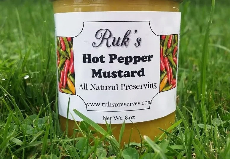 8 oz. Jar Hot Pepper Mustard is a customer favorite and is a combination of homemade mustard and home-grown hot banana peppers. This sweet & spicy condiment is great for any sandwich or served with a cheese and charcuterie board! Ingredients: Hot Banana Peppers, Vinegar, Sugar, Flour, Salt