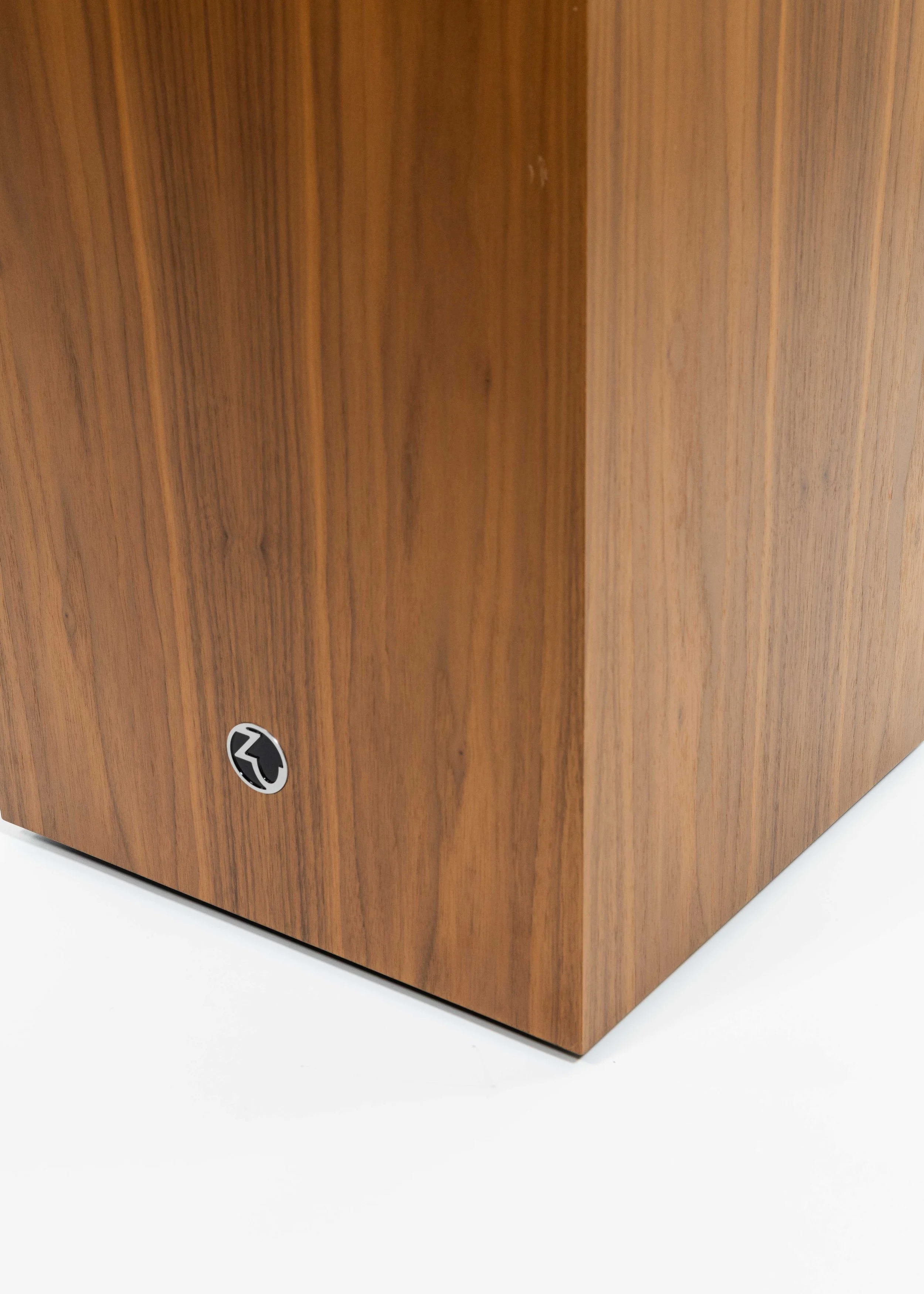 Closeup photo of Zu Audio Undertone subwoofer finished in American walnut.