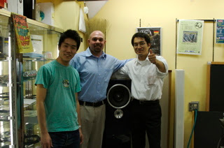 Sato, Adam, and Hiroshi posing with the Maserati Blue Nettuno Druid on display at Audio Union .