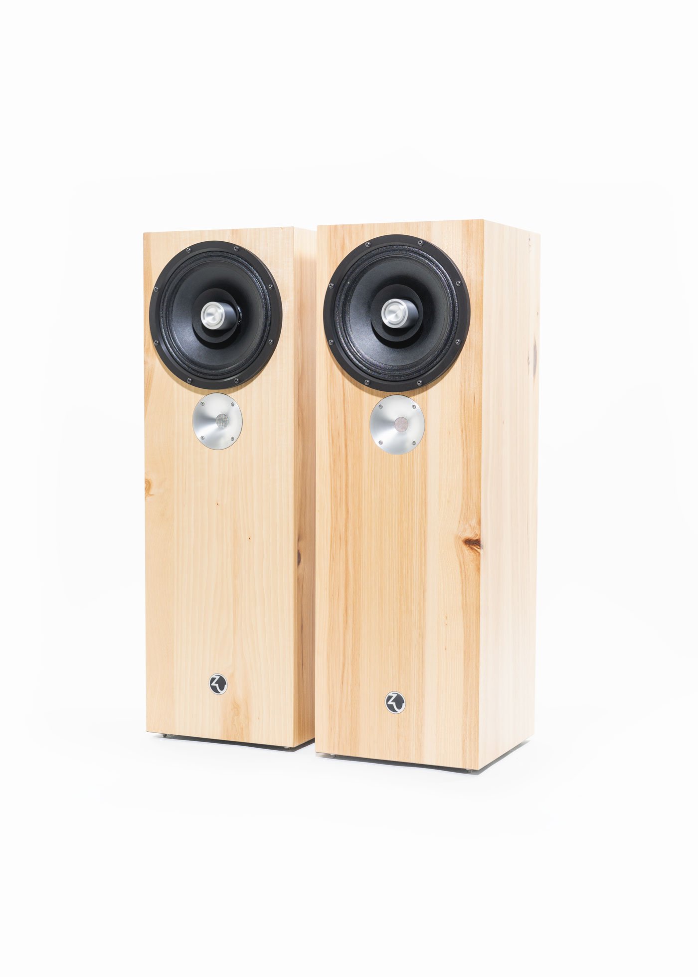 Photo of Zu DW-6 loudspeakers finished in hickory and fitted with black anodized full-range driver trim rings.
