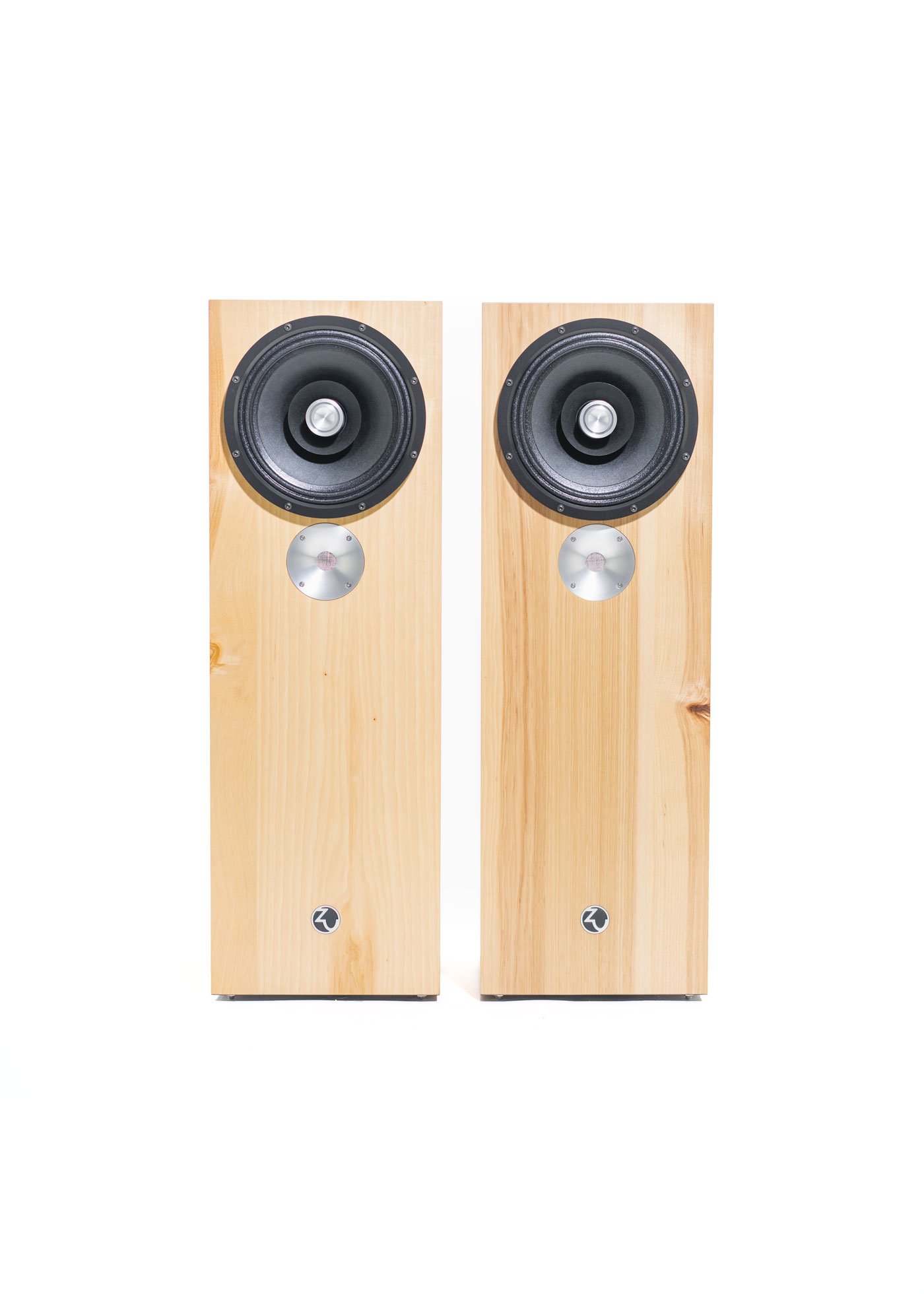 Photo of Zu DW-6 loudspeakers finished in hickory and fitted with black anodized full-range driver trim rings.