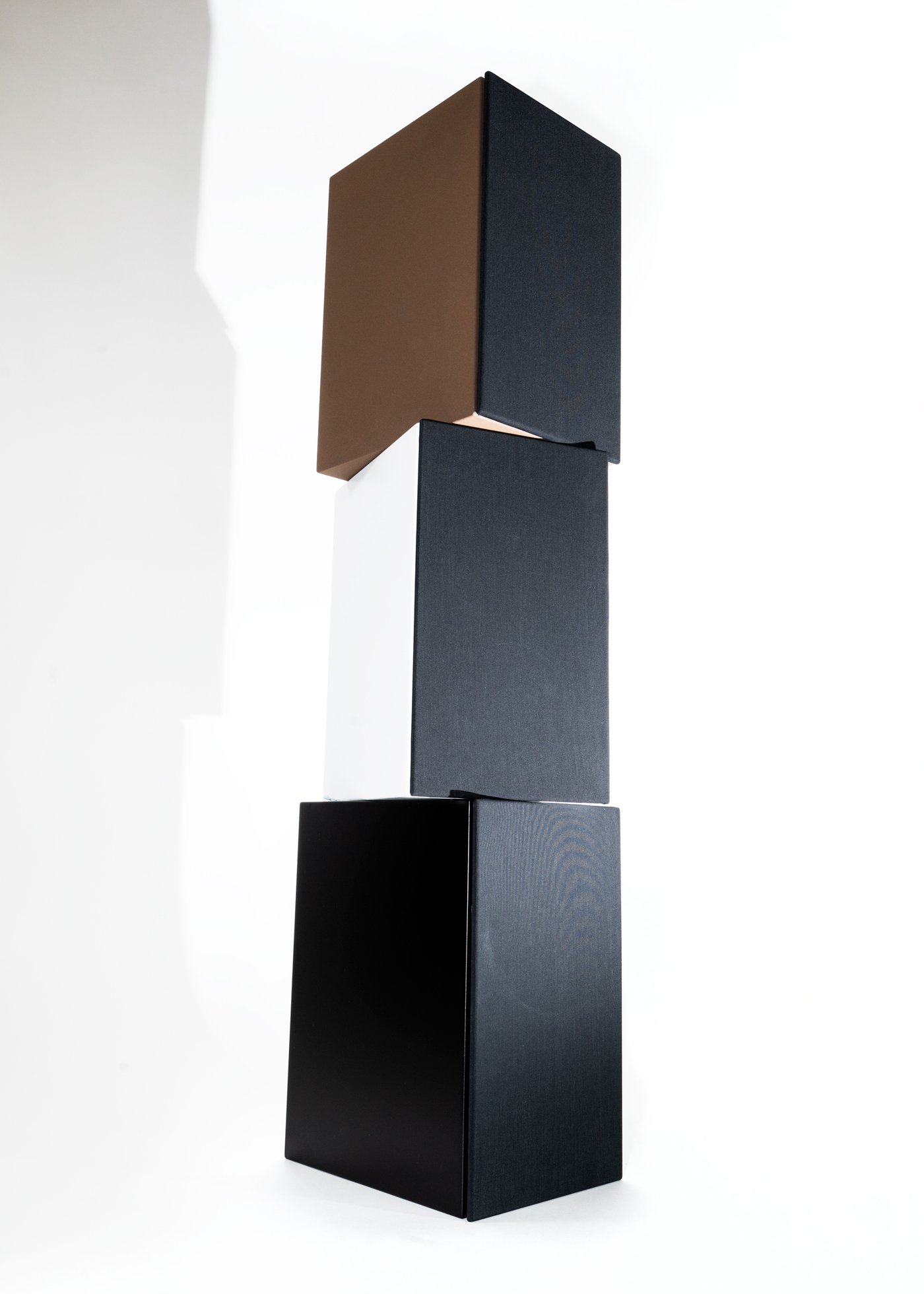 Photo of three Zu Method Bookshelf speakers in various colors artistically stacked.