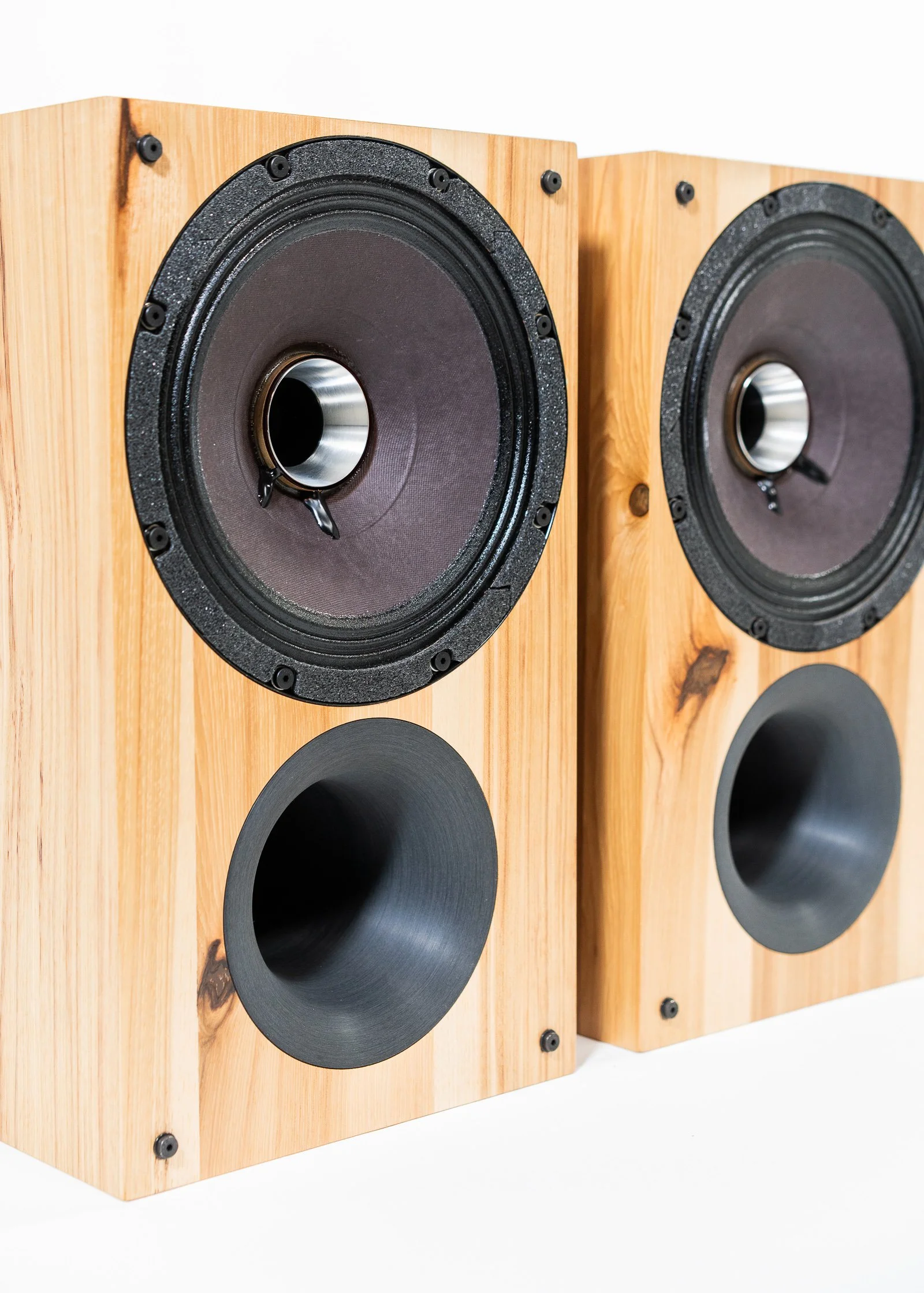 Closeup photo of Zu Audio Method Bookshelf speaker finished in rustic hickory.