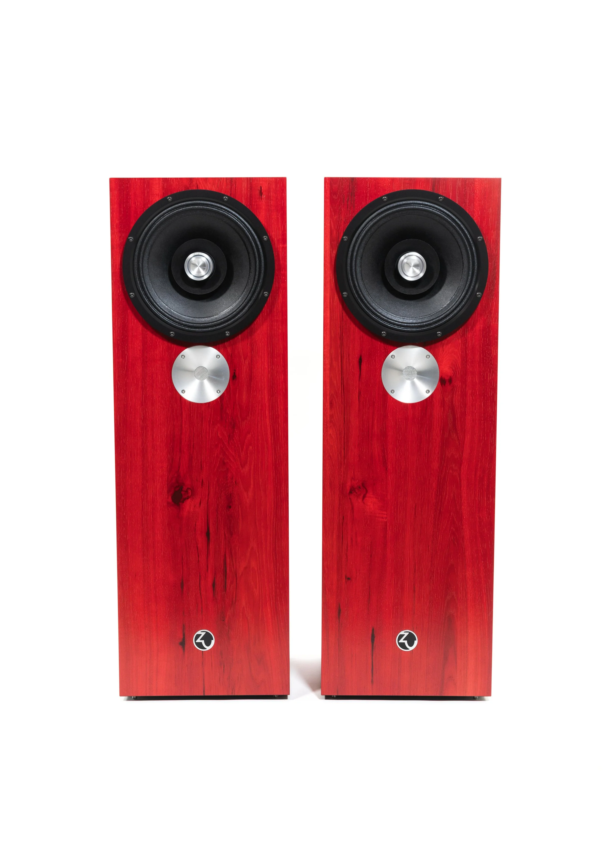 Photo of Zu DW-6 loudspeakers finished in ruby red hickory and feature black anodized trim-ring.