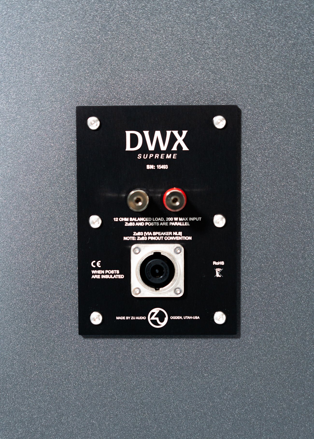 Closeup photo of Zu DWX Supreme nameplate and connections.