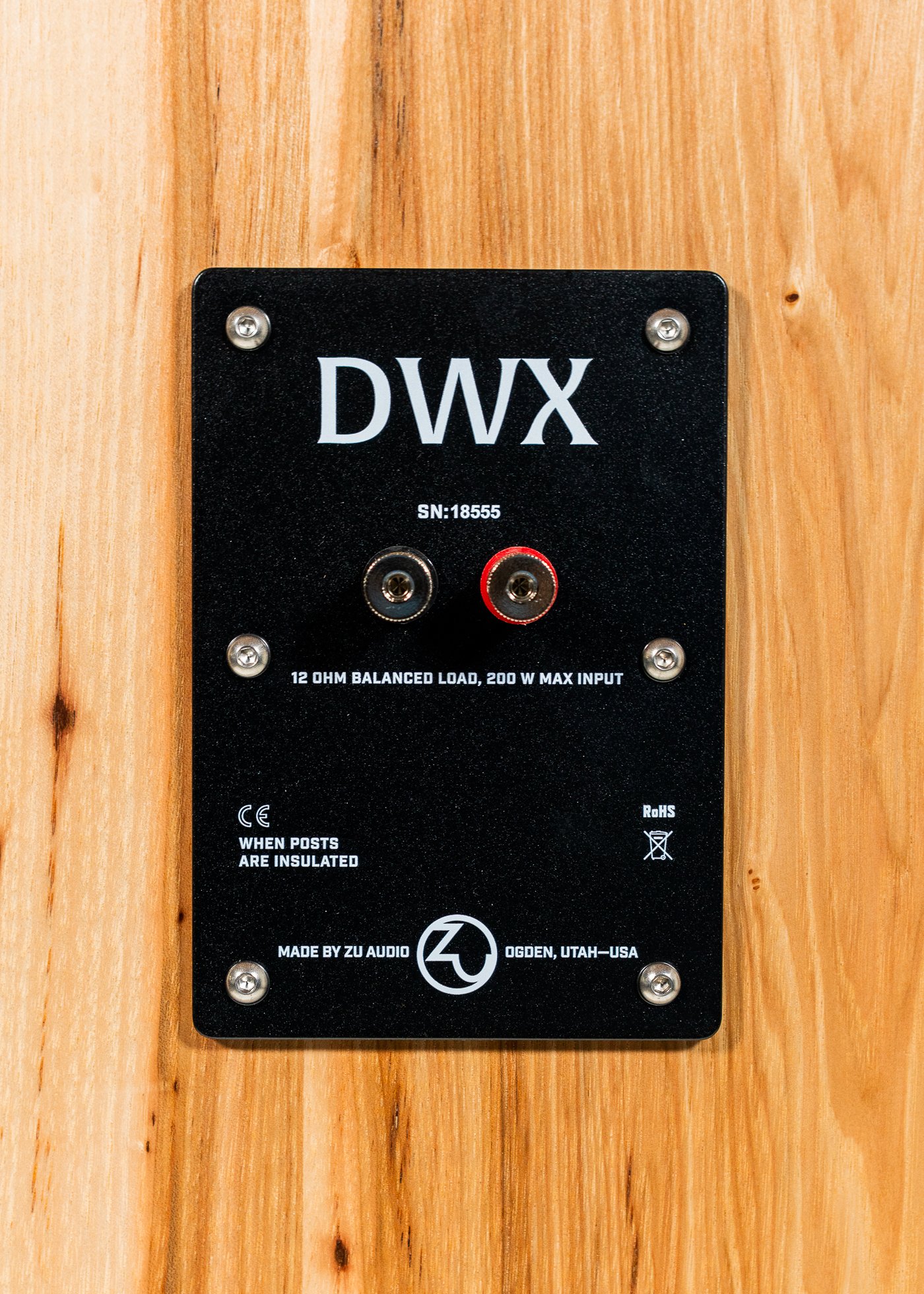 Nameplate and connections of Zu DWX (standard) finished in rustic hickory real wood veneer.