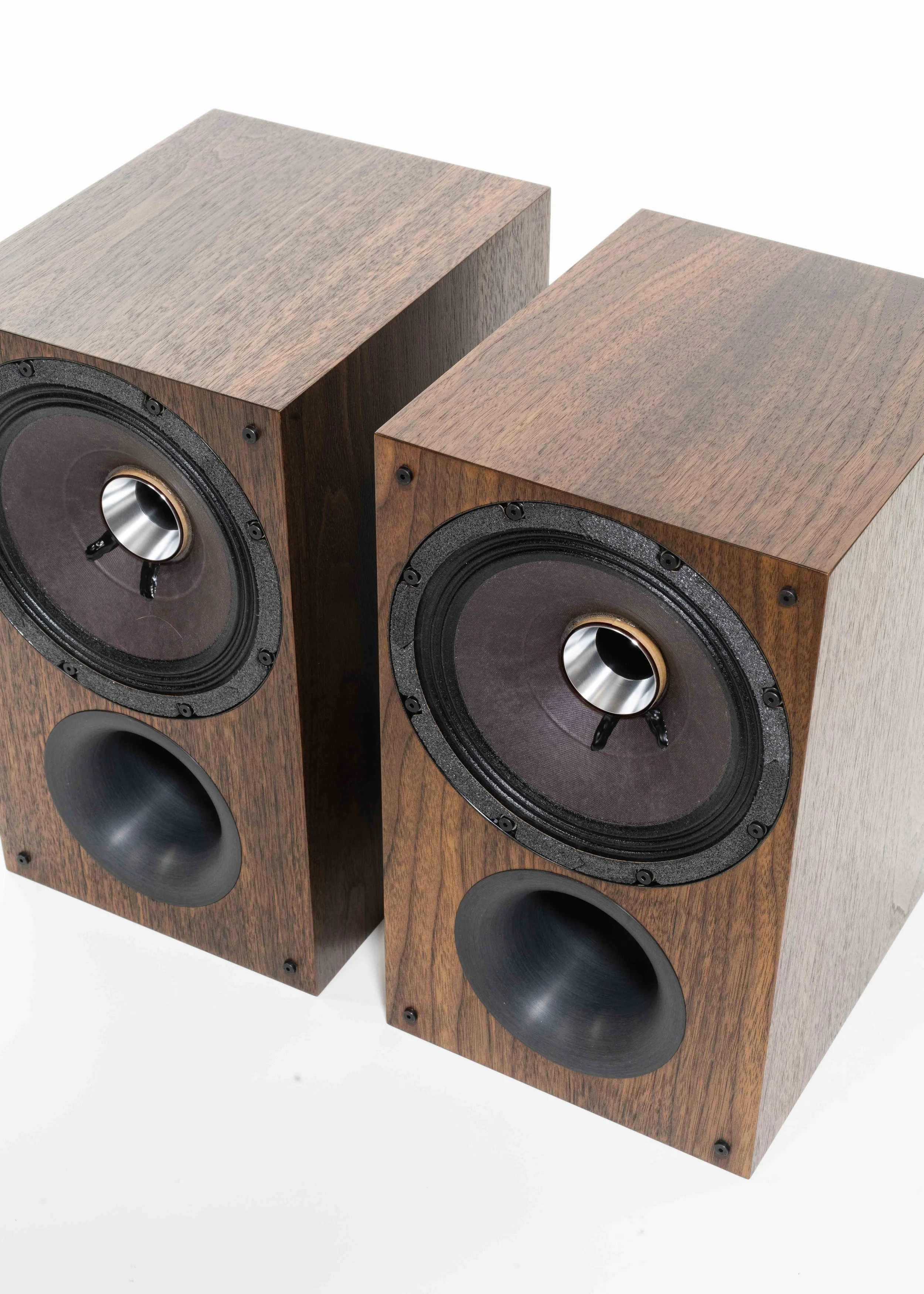 Closeup isometric view photo of Zu Audio Method Bookshelf loudspeakers finished in hand rubbed dark American walnut.