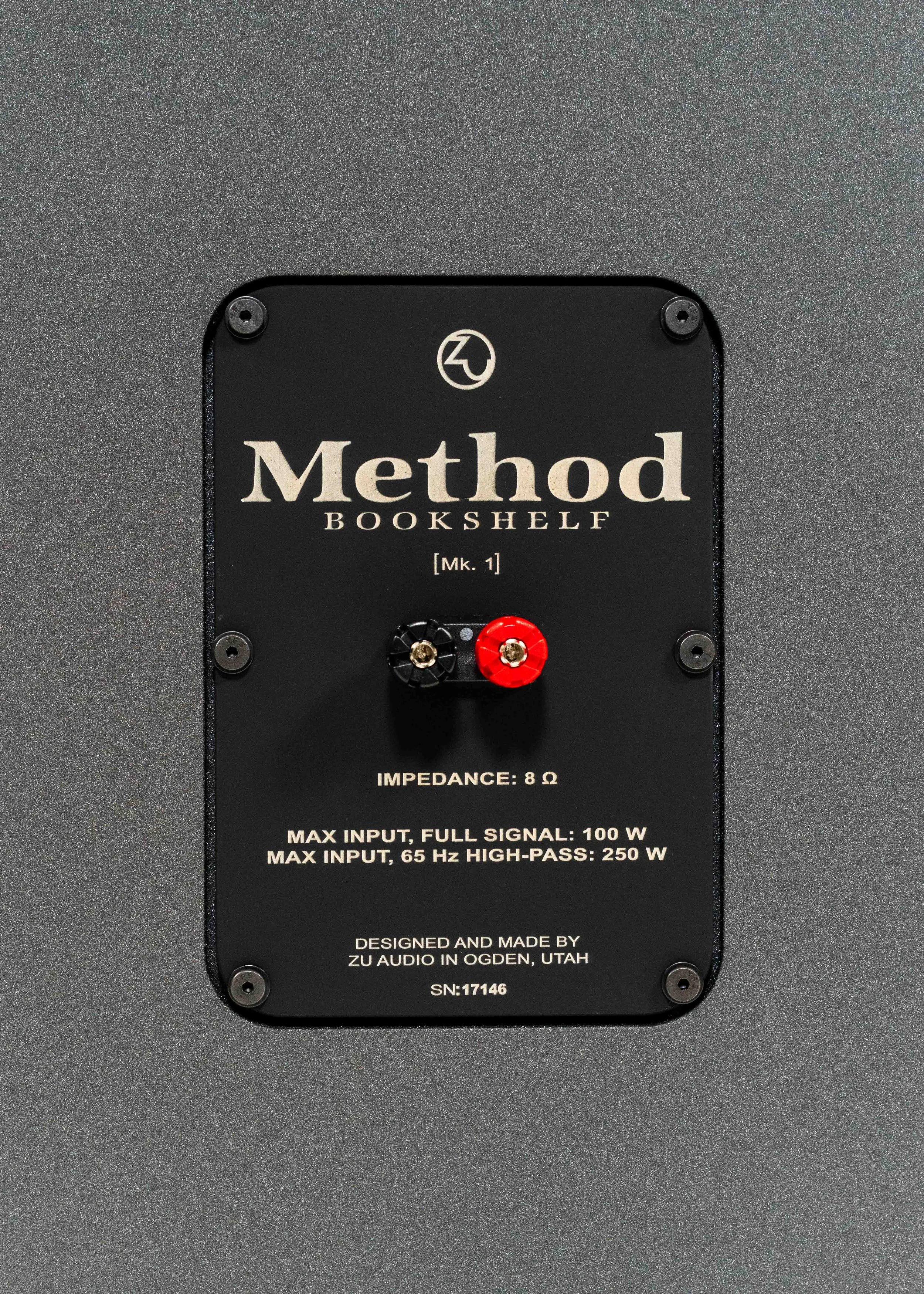 Nameplate photo of Zu Method Bookshelf finished in cosmic carbon including port tube.