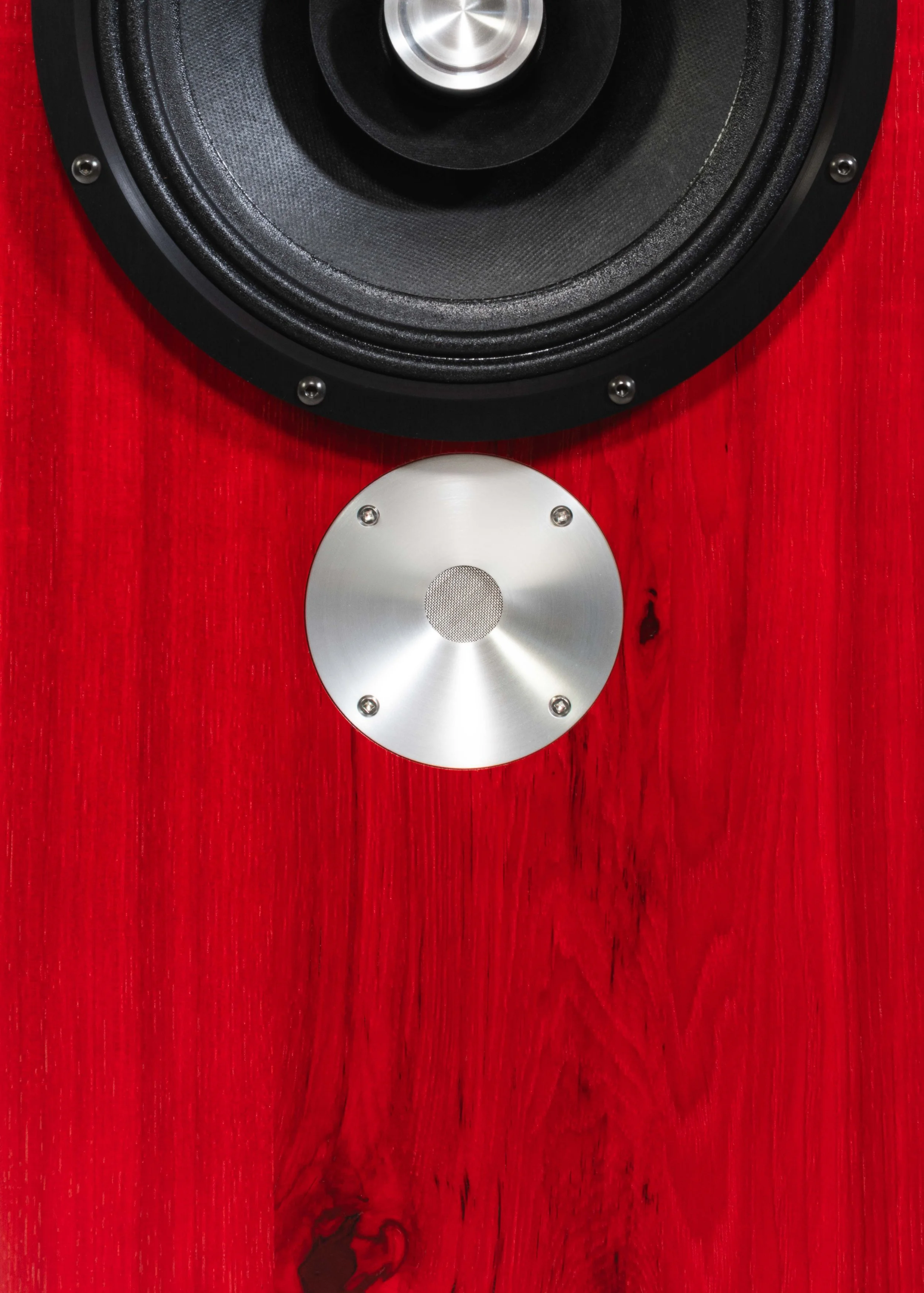 Closeup photo of Zu DW-6 loudspeakers finished in ruby red hickory and feature black anodized trim-ring.