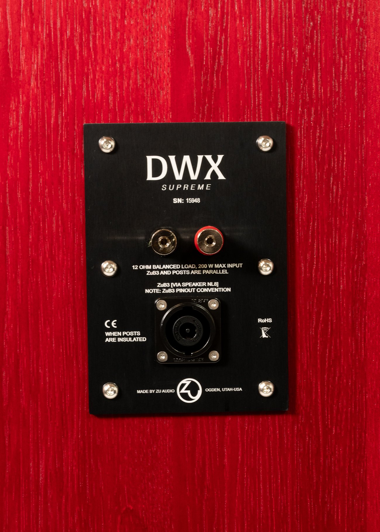 Photo of nameplate of Zu DWX Supreme finished ruby red hickory.