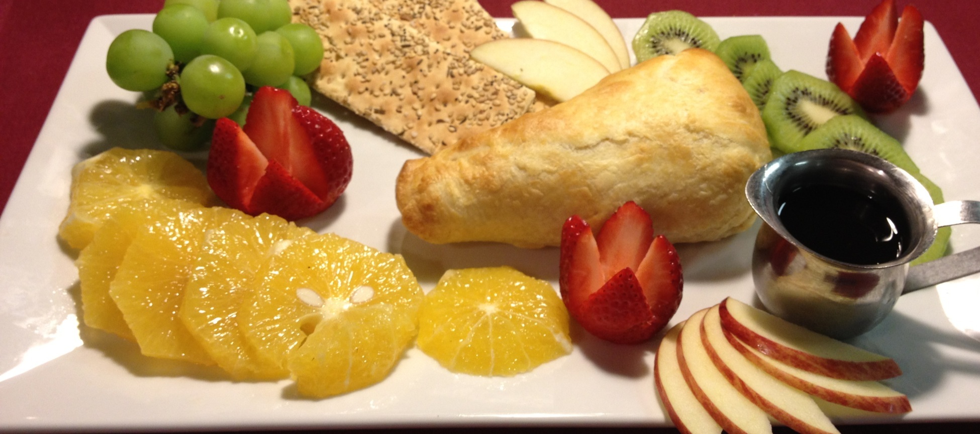 Baked Brie in Puff Pastry Crust with Fresh Fruit and Crackers..Sweet Port Wine Sauce