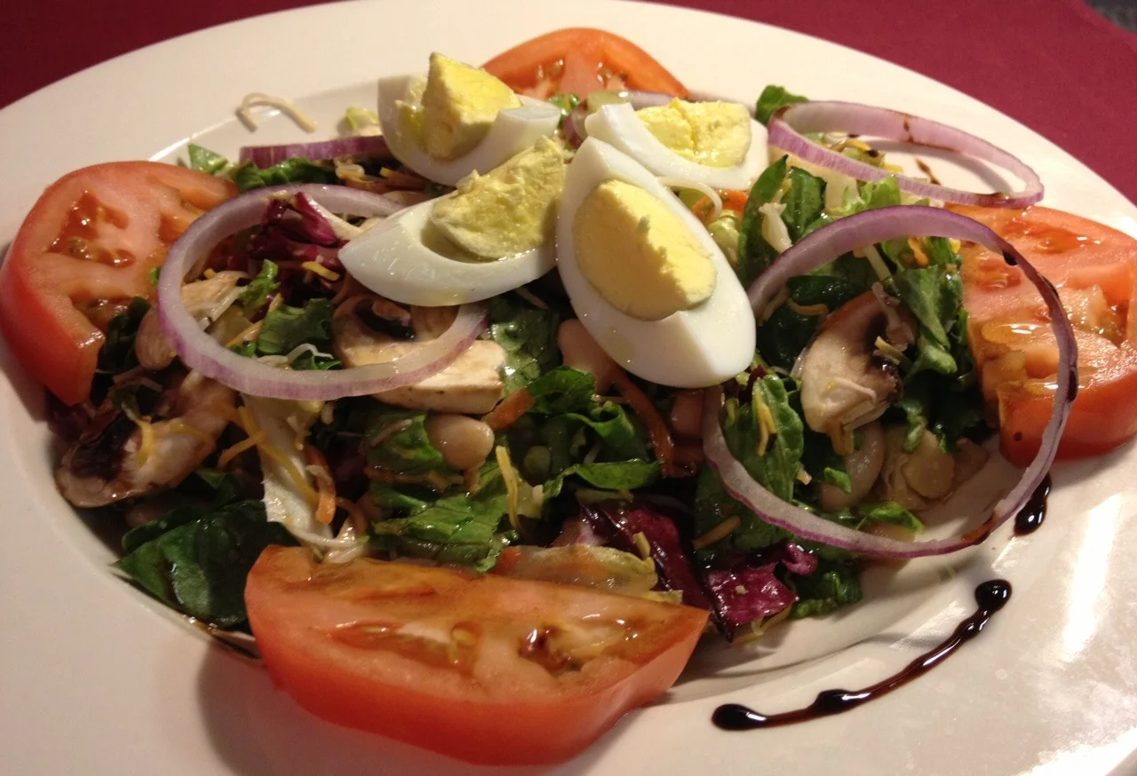 Quiet Man Tossed Salad...Mixed Greens, Hard-Cooked Egg, Pickled Beets, Tomatoes, Mushrooms, Thin Red Onions, Raw Carrots served with Vinaigrette Dressing