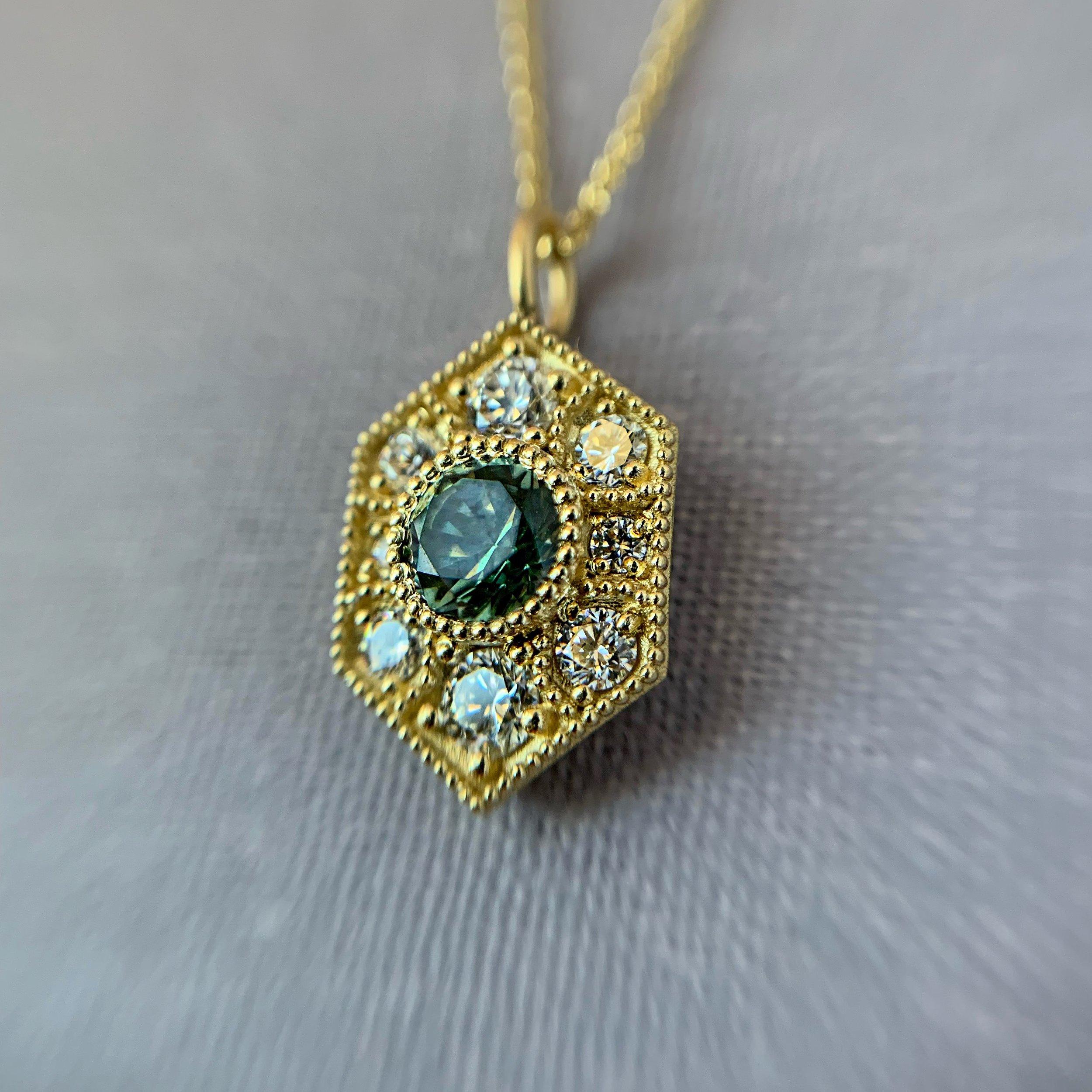 Geometric-gold-pendnat-diamond-andsapphire.JPG
