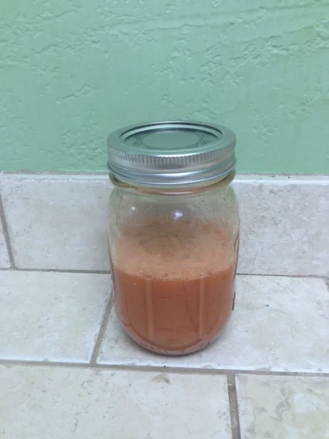 An earlier version of the juice - still looking a little pinkish, rather than neon orange.