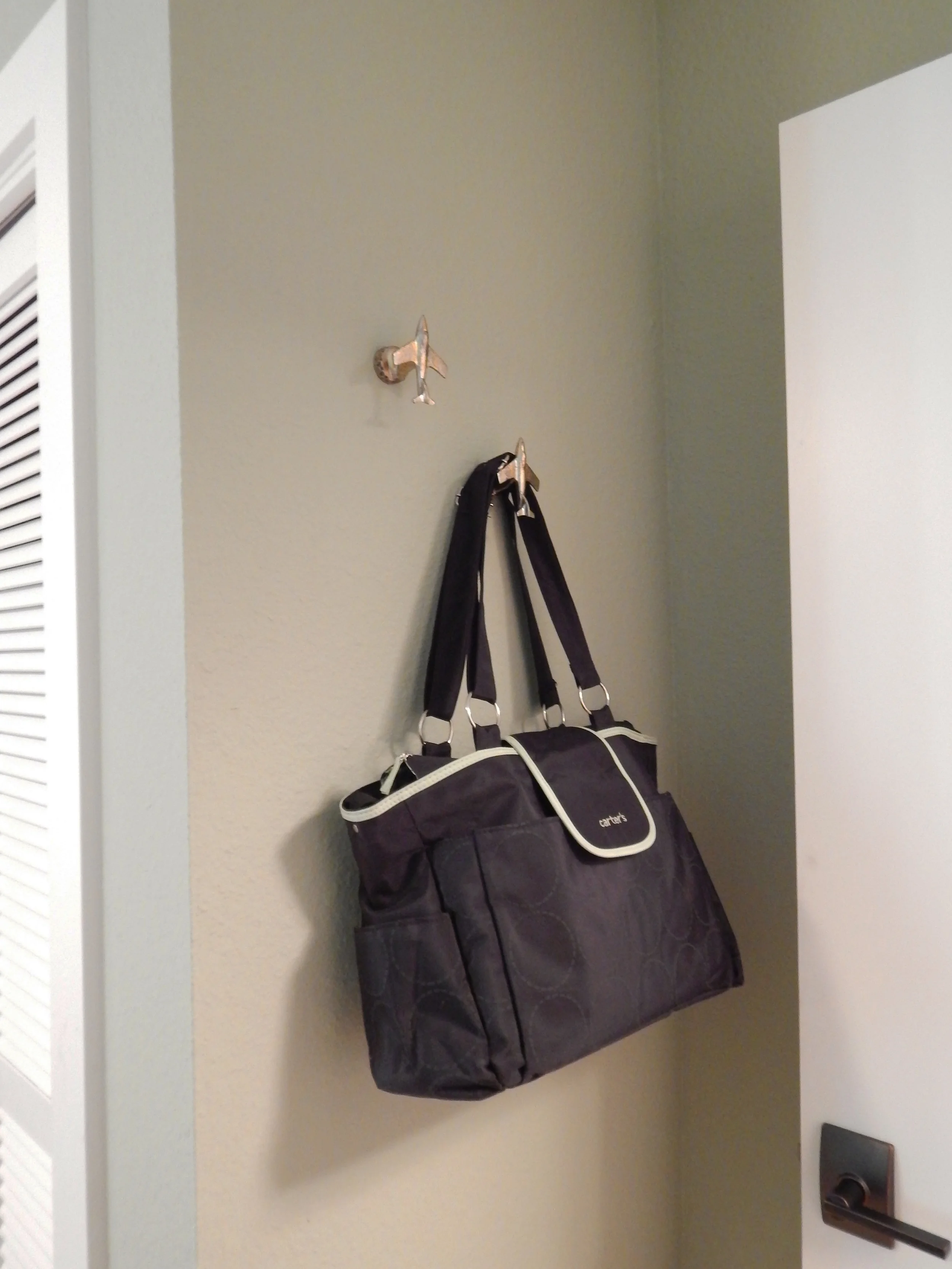 Airplane hooks by the entry door