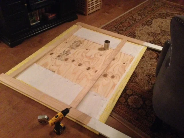 Step Seven: Paint wood frame (that will show from front and side of bed) then line up on back of frame to add sturdiness to headboard. Use drill and screws to attach to plywood. 