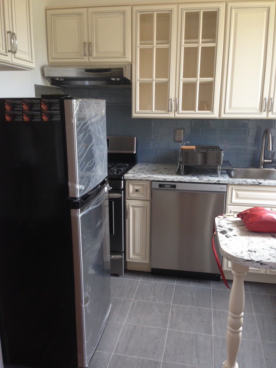 The kitchen as seen from the dining nook area (or back corner of living room). 