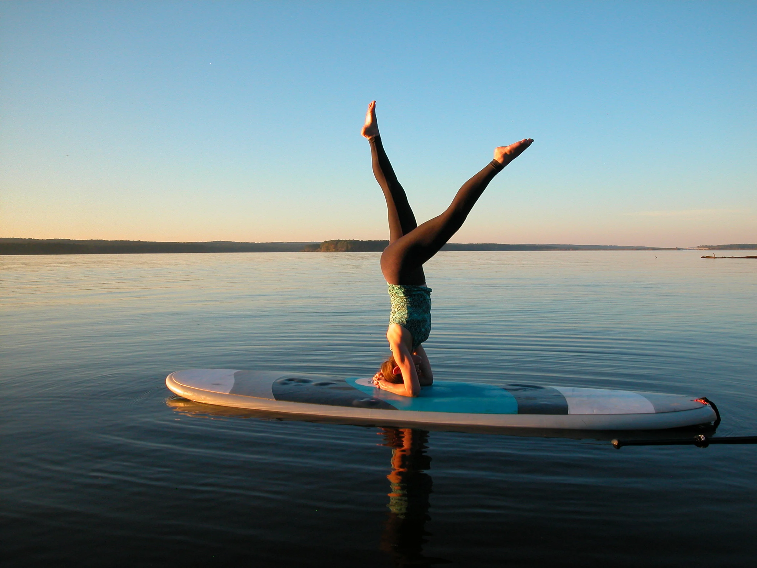 circa 2013 Allison demonstrates Stand on head paddleboarding!